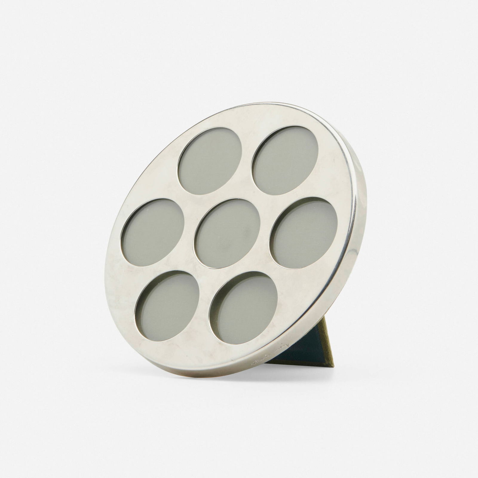 Gabriella Crespi, Picture frame: Gabriella Crespi Picture frame Italy, 1965chrome-plated brass, glass 4.75 d x 7.5 dia in (12 x 19 cm) Impressed signature to edge 'Gabriella Crespi'. This work will ship fr