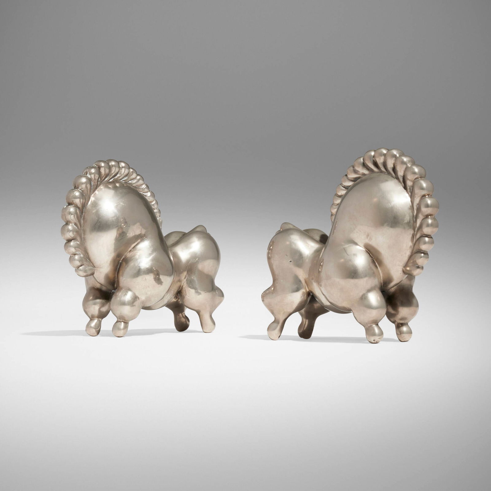 Russel Wright, Libbiloo bookends, pair: Russel Wright Libbiloo bookends, pair Russel Wright, Inc.USA, c. 1930nickel-plated brass 5.5 h x 6.5 w x 3 d in (14 x 17 x 8 cm) Literature: Collector's Encyclopedia