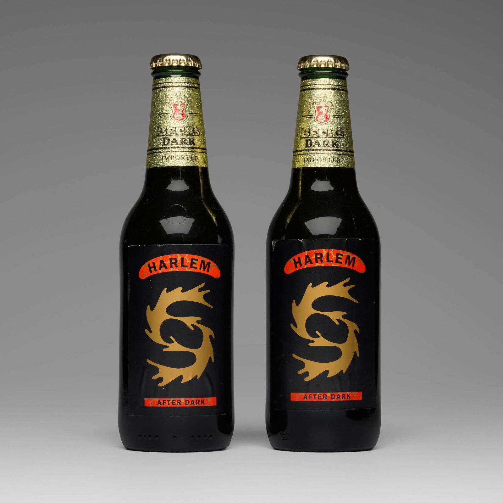 David Hammons, Harlem After Dark (Beck's beer bottles): David Hammons Harlem After Dark (Beck's beer bottles) 1997beer bottles, printed paper 8.375 h x 2.5 dia in (21 x 6 cm) Each example with paper label to recto 'Harlem After Dark' and to verso '