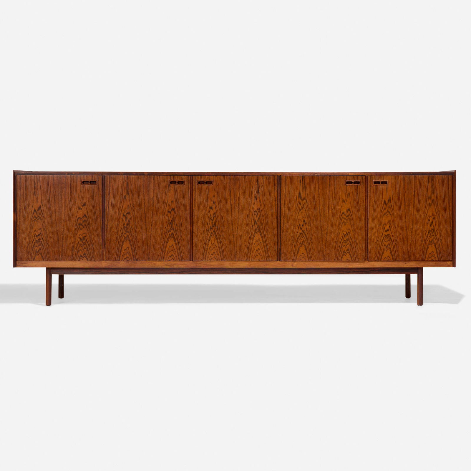 Ib Kofod-Larsen, Cabinet: Ib Kofod-Larsen Cabinet Brande MobelfabrikDenmark, c. 1960rosewood 31.625 h x 101.875 w x 19.5 d in (80 x 259 x 50 cm) Cabinet features one door concealing bar storage with one laminate