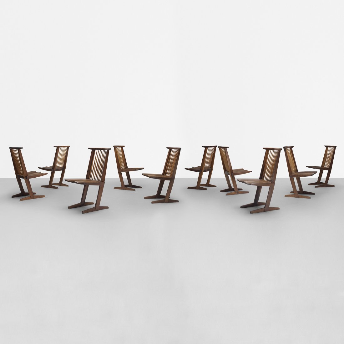 George Nakashima Conoid dining chairs, set of ten: George Nakashima Conoid dining chairs, set of ten USA, c. 1970 American black walnut, hickory 20 w x 22 d x 35.5 h inches Literature: George Nakashima, Woodworker, studio catalog, unpaginated