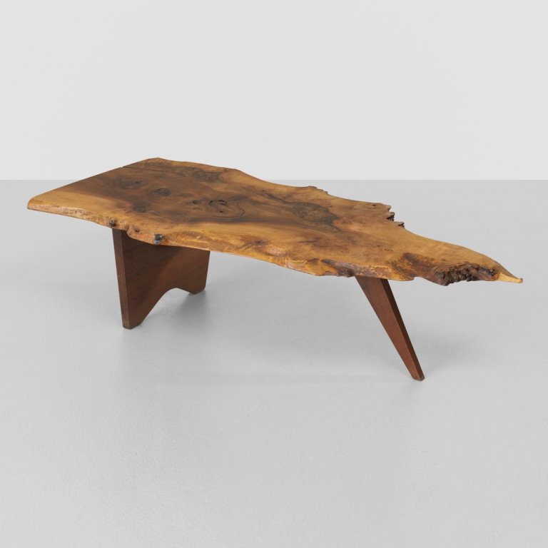 George Nakashima Slab coffee table: George Nakashima Slab coffee table USA, 1958 English walnut 53 w x 24 d x 14 h inches Highly figured and expressive single slab top with numerous fissures, burled edges, one rosewood butterfly, sap gr