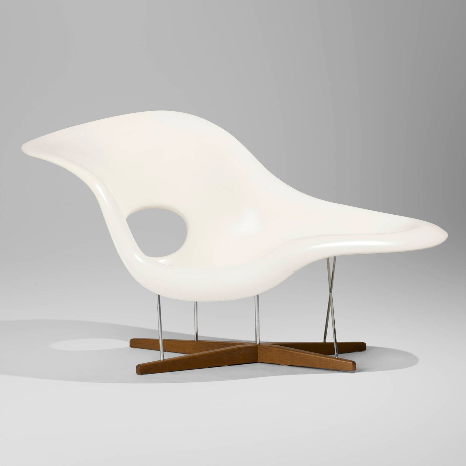 Charles and Ray Eames, La Chaise: Charles and Ray Eames La Chaise VitraUSA / Switzerland, 1948 / c. 1995lacquered fiberglass, chrome-plated steel, oak 34.5 h x 59 w x 35.5 d in (88 x 150 x 90 cm) Though first introduced