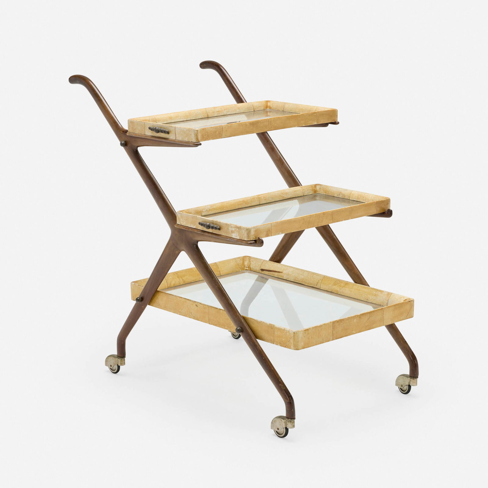 Aldo Tura, Three-tier bar cart: Aldo Tura Three-tier bar cart Italy, c. 1955walnut, vellum, glass, brass 32 h x 21.125 w x 35 d in (81 x 54 x 89 cm) Bar cart features two removable trays. This work will s