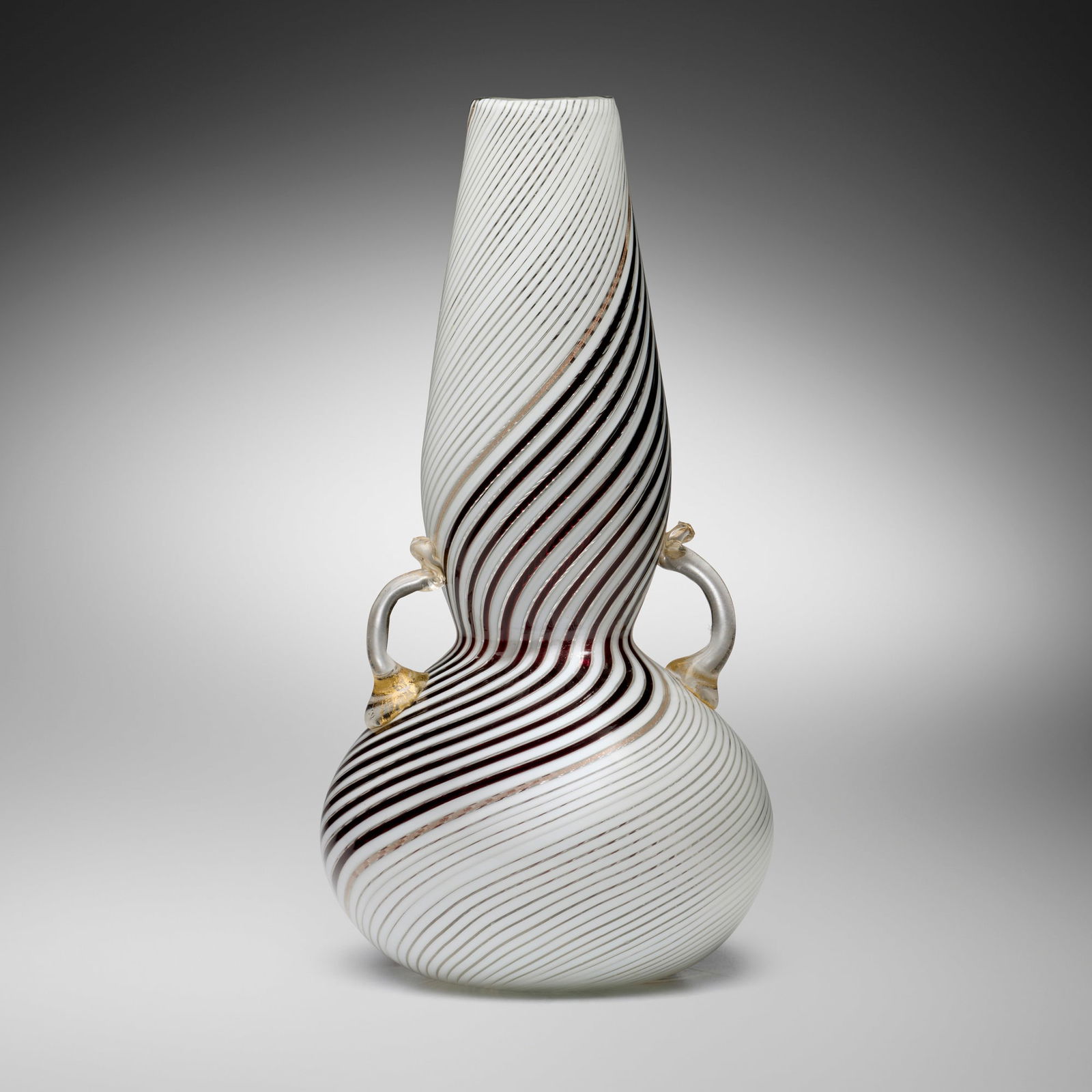 Dino Martens, Bianca Nero vase: Dino Martens Bianca Nero vase Aureliano TosoItaly, 1954fused glass canes with gold leaf and applied details 13.25 h x 6.75 dia in (34 x 17 cm) Remnants of paper label to underside 'Made