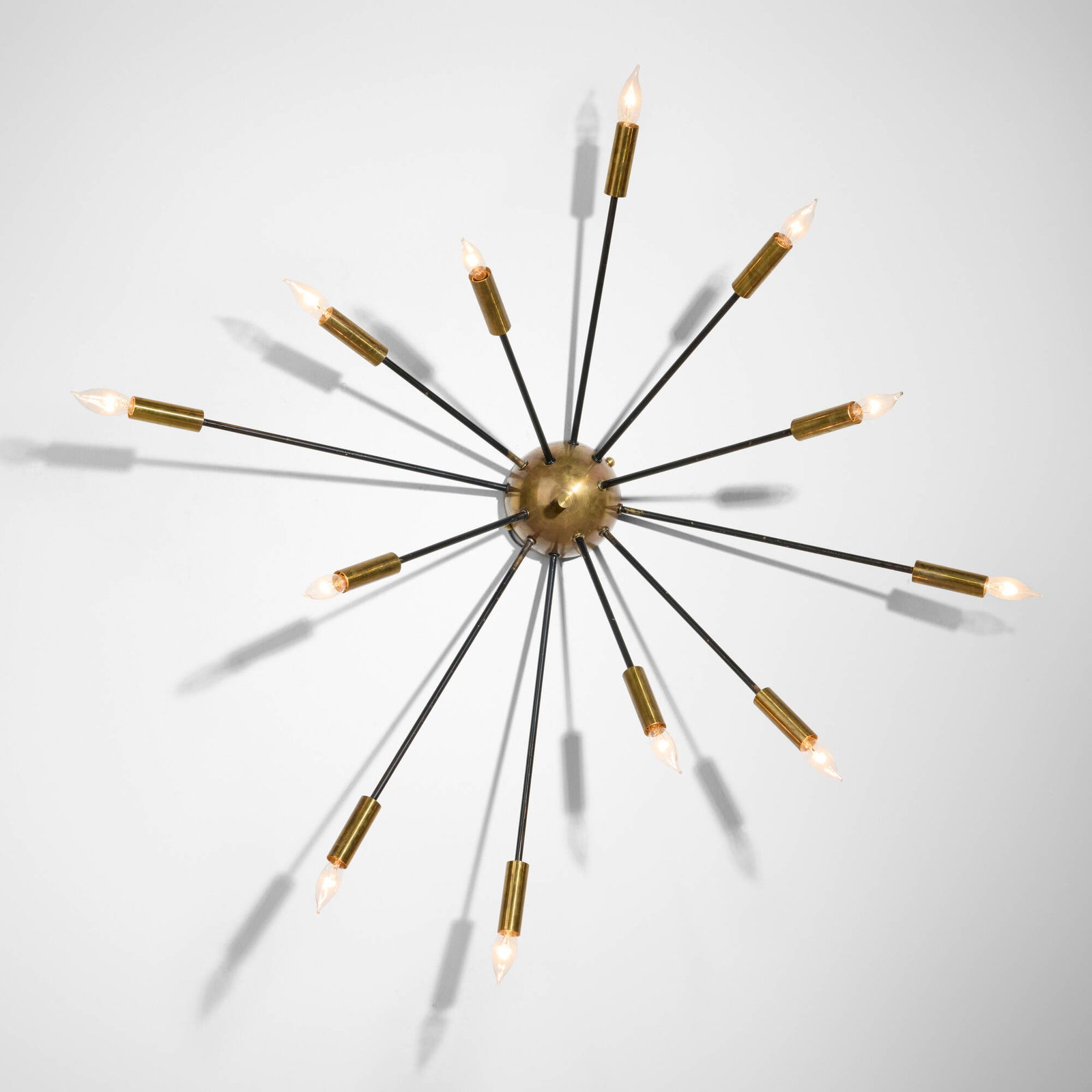 Stilnovo, Twelve-arm wall lamp: Stilnovo Twelve-arm wall lamp Italy, c. 1960 brass, enameled brass 33.25 h x 37.25 w x 11.25 d in (84 x 95 x 29 cm) This work will ship from Lambertville, New Jersey.