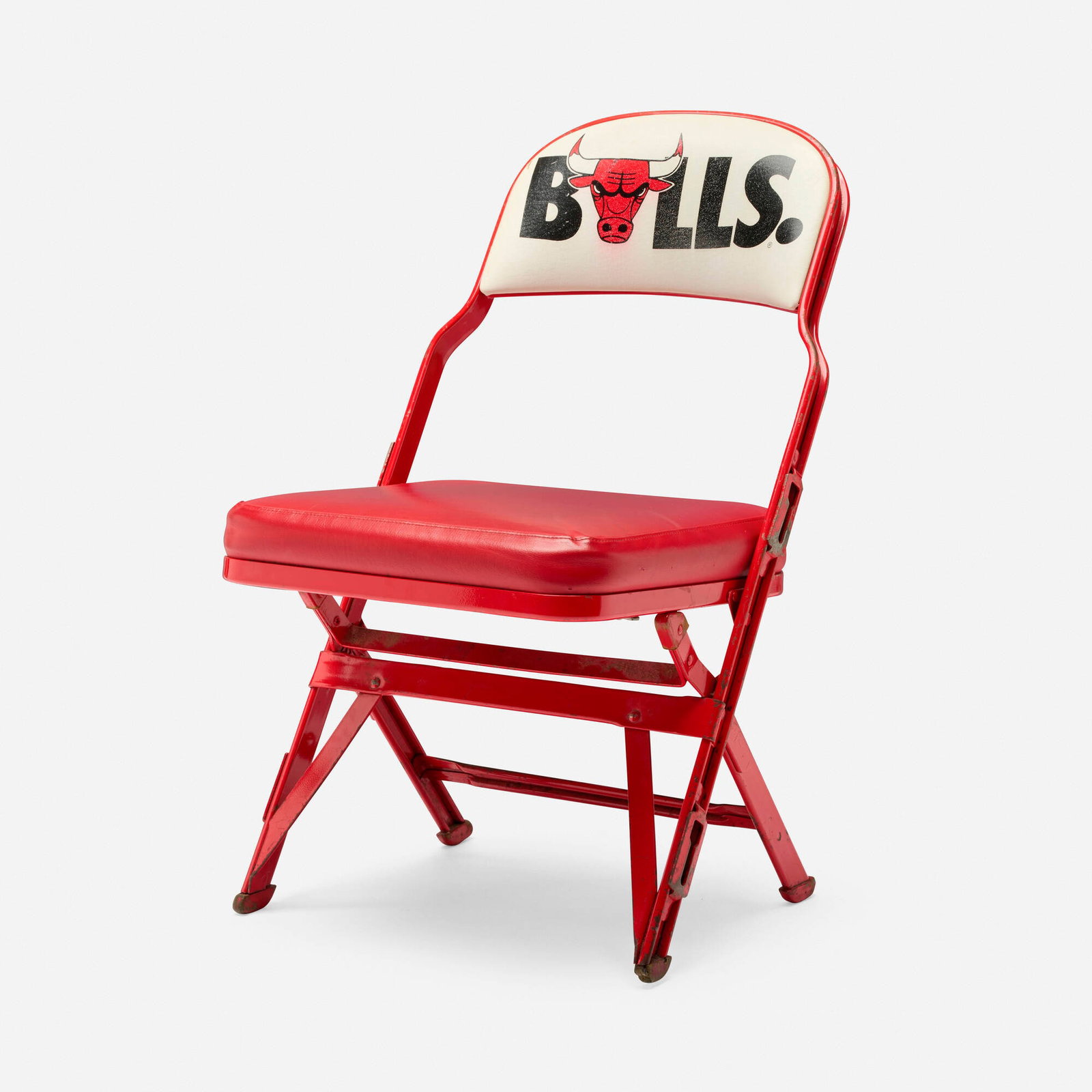 Chicago Bulls folding chair from the Chicago Stadium: Chicago Bulls folding chair from the Chicago Stadium USA, c. 1990 enameled metal, vinyl upholstery 30 h x 18 w x 23 d in (76 x 46 x 58 cm) Illegible manufacturer's label to underside. Provenance: