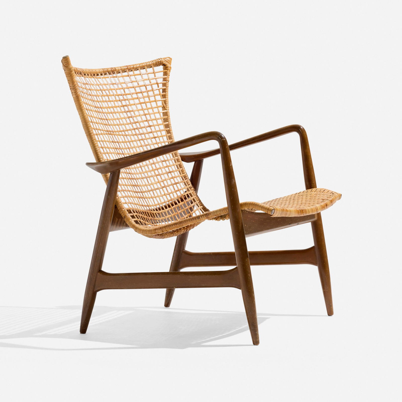 Ib Kofod-Larsen, Armchair: Ib Kofod-Larsen Armchair SeligDenmark / USA, c. 1955caning, beech, brass 31.5 h x 25.75 w x 25 d in (80 x 65 x 63 cm) This work will ship from Los Angeles, California.
