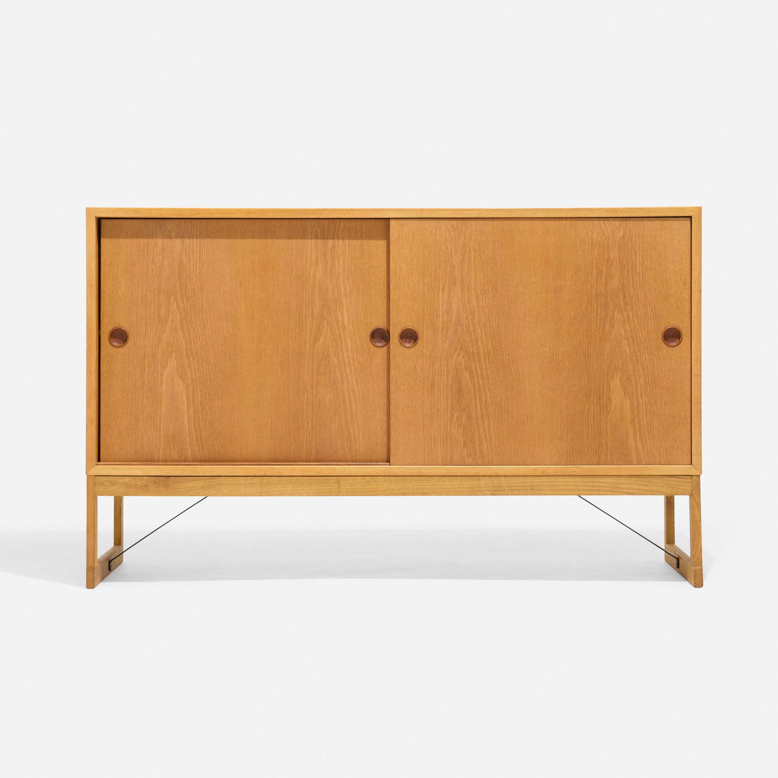Borge Mogensen, Cabinet: Borge Mogensen Cabinet Karl Andersson & SonerDenmark / Sweden, c. 1960oak, enameled steel 33 h x 53 w x 18 d in (84 x 135 x 46 cm) Cabinet features two sliding doors concealing two shelv