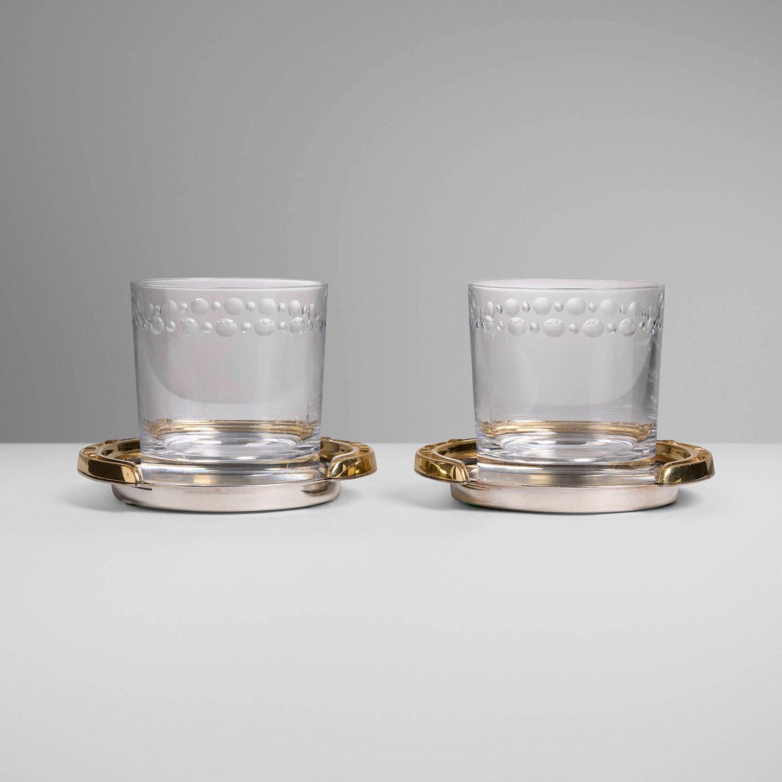 Hermes, Fer a Cheval coasters with Tiffany & Co. glasses, pair (1 of 3)
