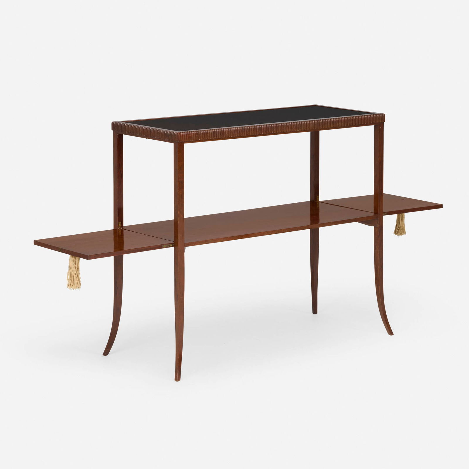 Emile-Jacques Ruhlmann, Two-tier console table: Emile-Jacques Ruhlmann Two-tier console table France, c. 1930mahogany, glass, tassels 35.5 h x 40.5 w x 17.75 d in (90 x 103 x 45 cm) This console table was selected by Peter Marino for Hedda