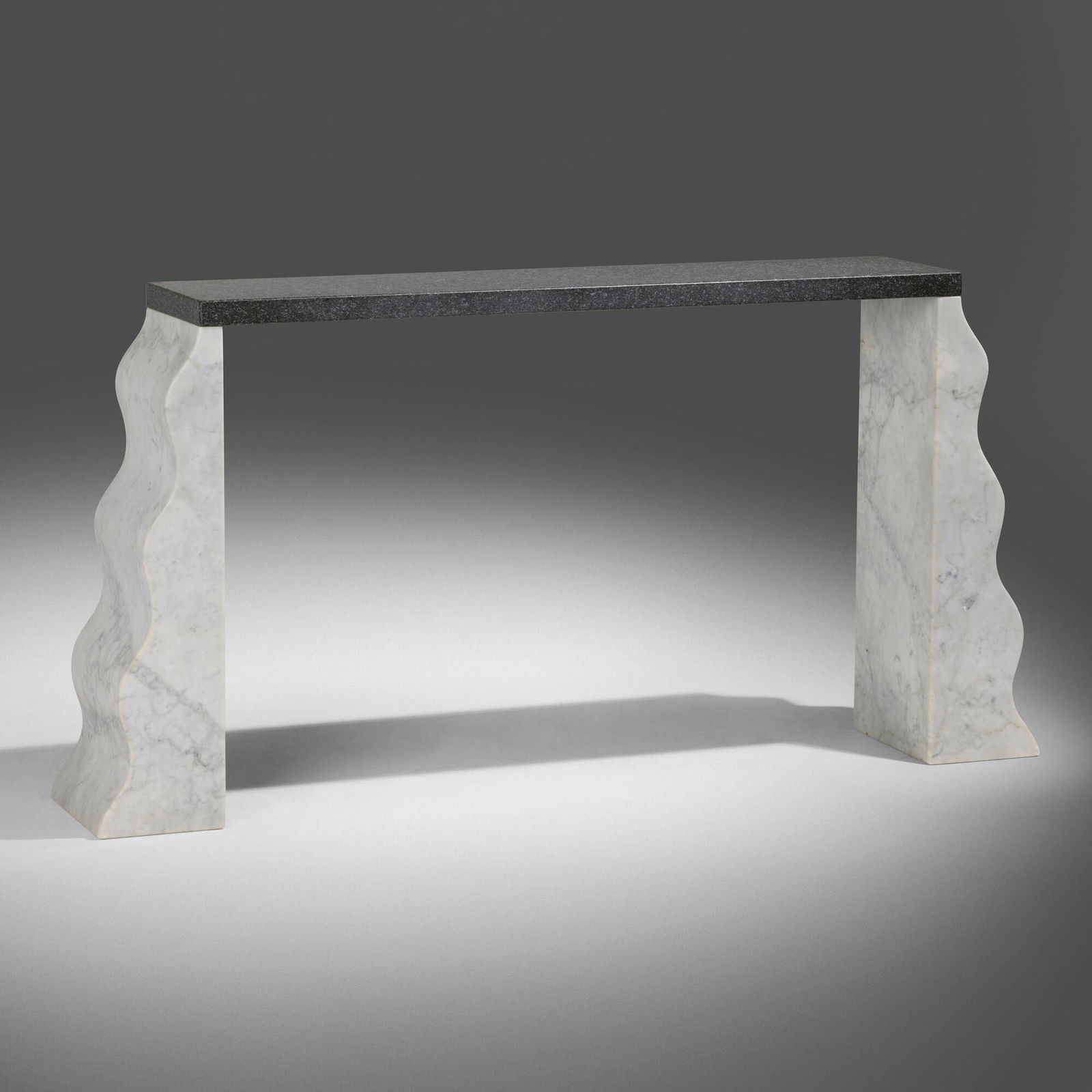 Ettore Sottsass, Montenegro console table: Ettore Sottsass Montenegro console table Ultima EdizioneItaly, 1992Cararra marble, granite 39.4 h x 79.25 w x 14.25 d in (100 x 201 x 36 cm) Provenance: Private Collecti