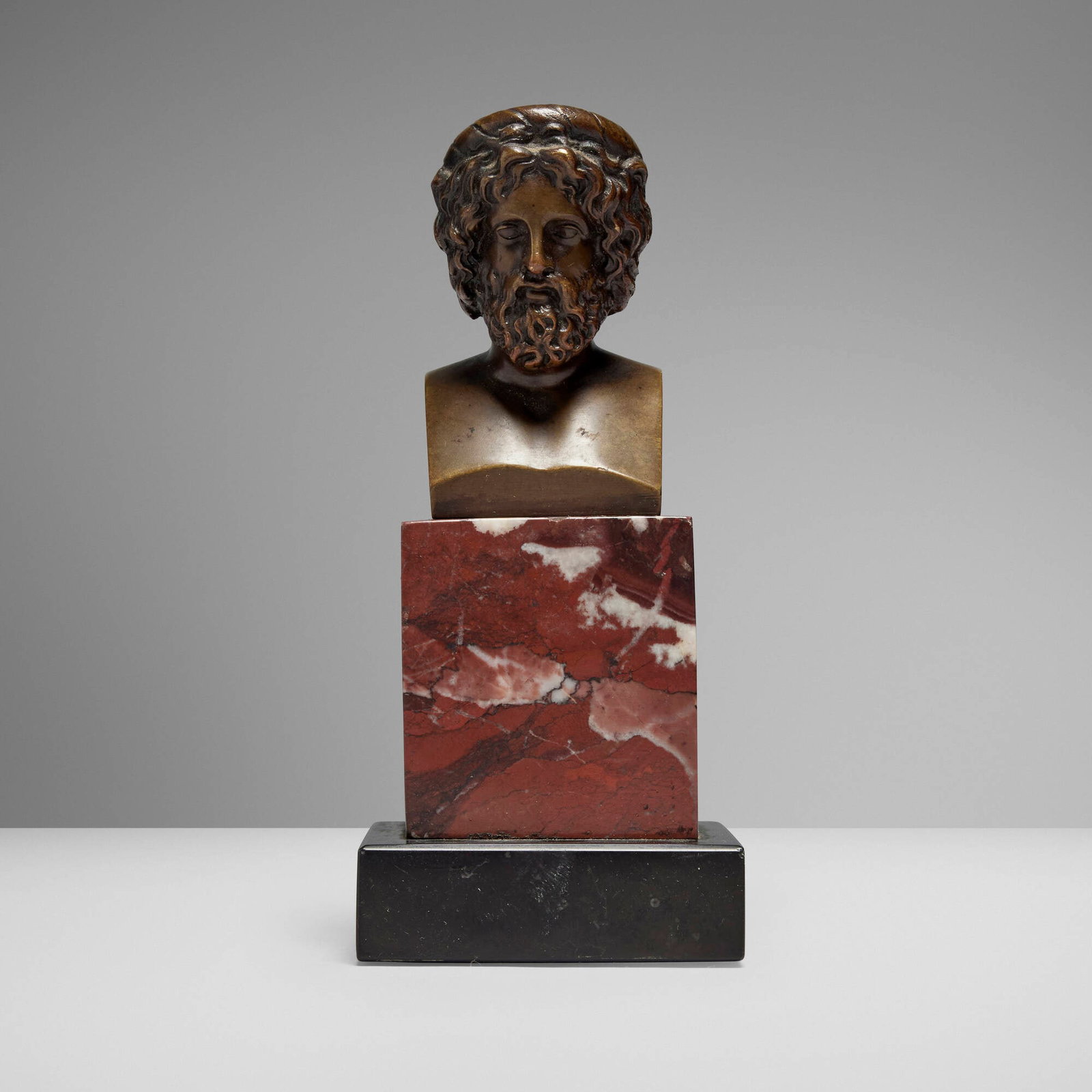 Grand Tour, Bust of Aeskulap: Grand Tour Bust of Aeskulap mid to late 19th century bronze, marble 5.25 h x 2.25 w x 2 d in (13 x 6 x 5 cm) Impressed title and inscription to reverse 'Aeskulap Bronze'. Provena