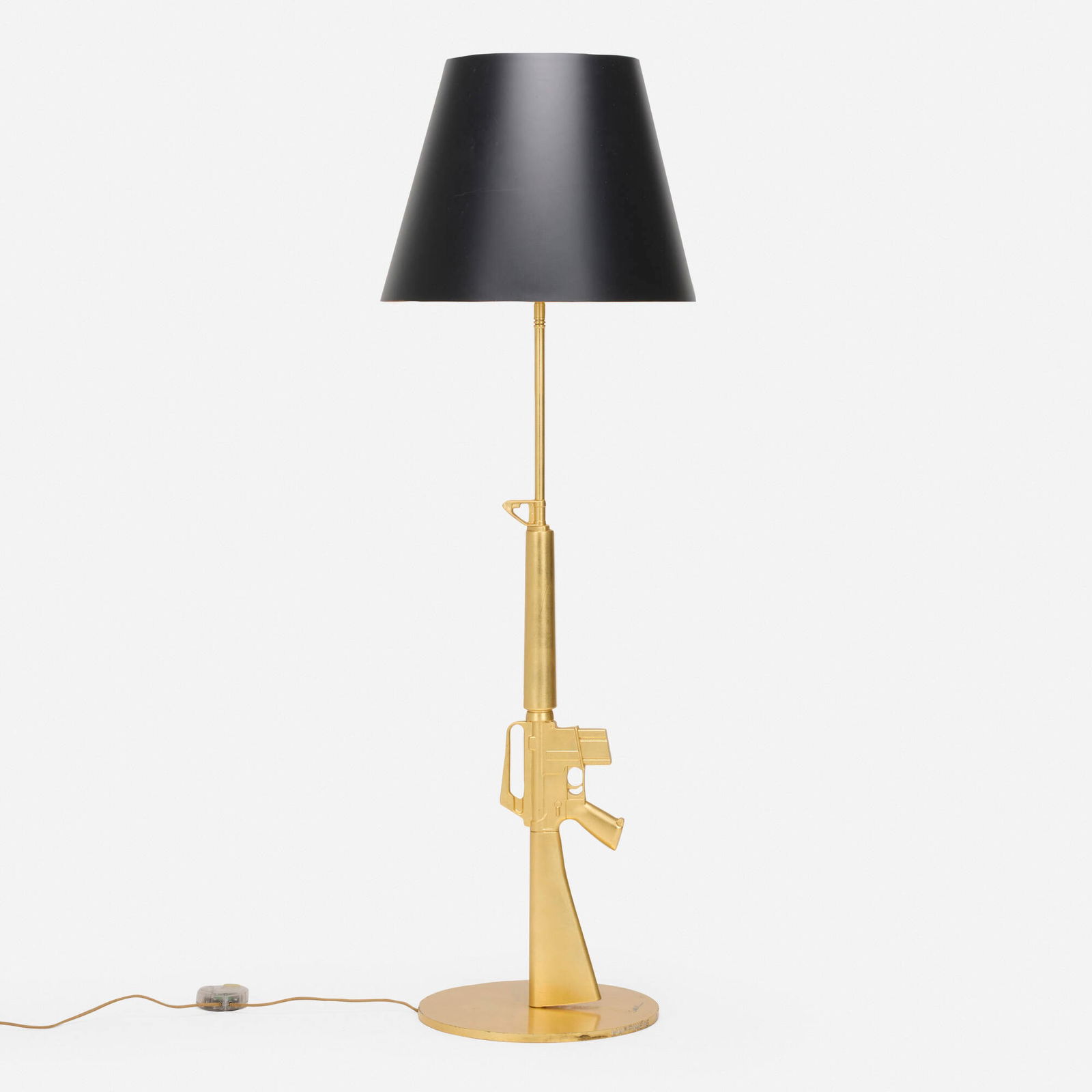 Philippe Starck, Lounge Gun floor lamp: Philippe Starck Lounge Gun floor lamp FlosFrance / Italy, 2005gold leaf over aluminum and steel 66.5 h x 22 dia in (169 x 56 cm) Signed to base 'Starck'. Incised to edge of base 'Happine