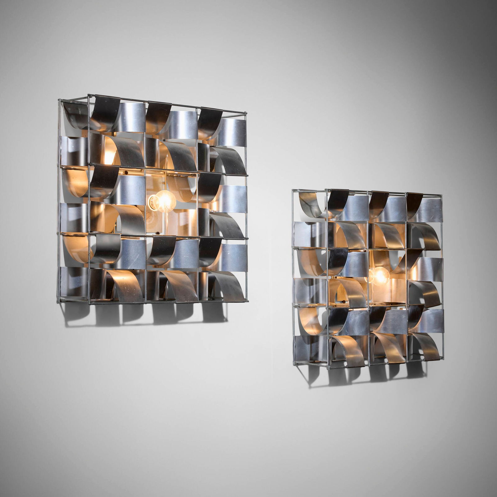 Max Sauze, Sconces, pair: Max Sauze Sconces, pair France, c. 1970aluminum, steel 16.5 h x 16.25 w x 4.5 d in (42 x 41 x 11 cm) This work will ship from Chicago, Illinois.