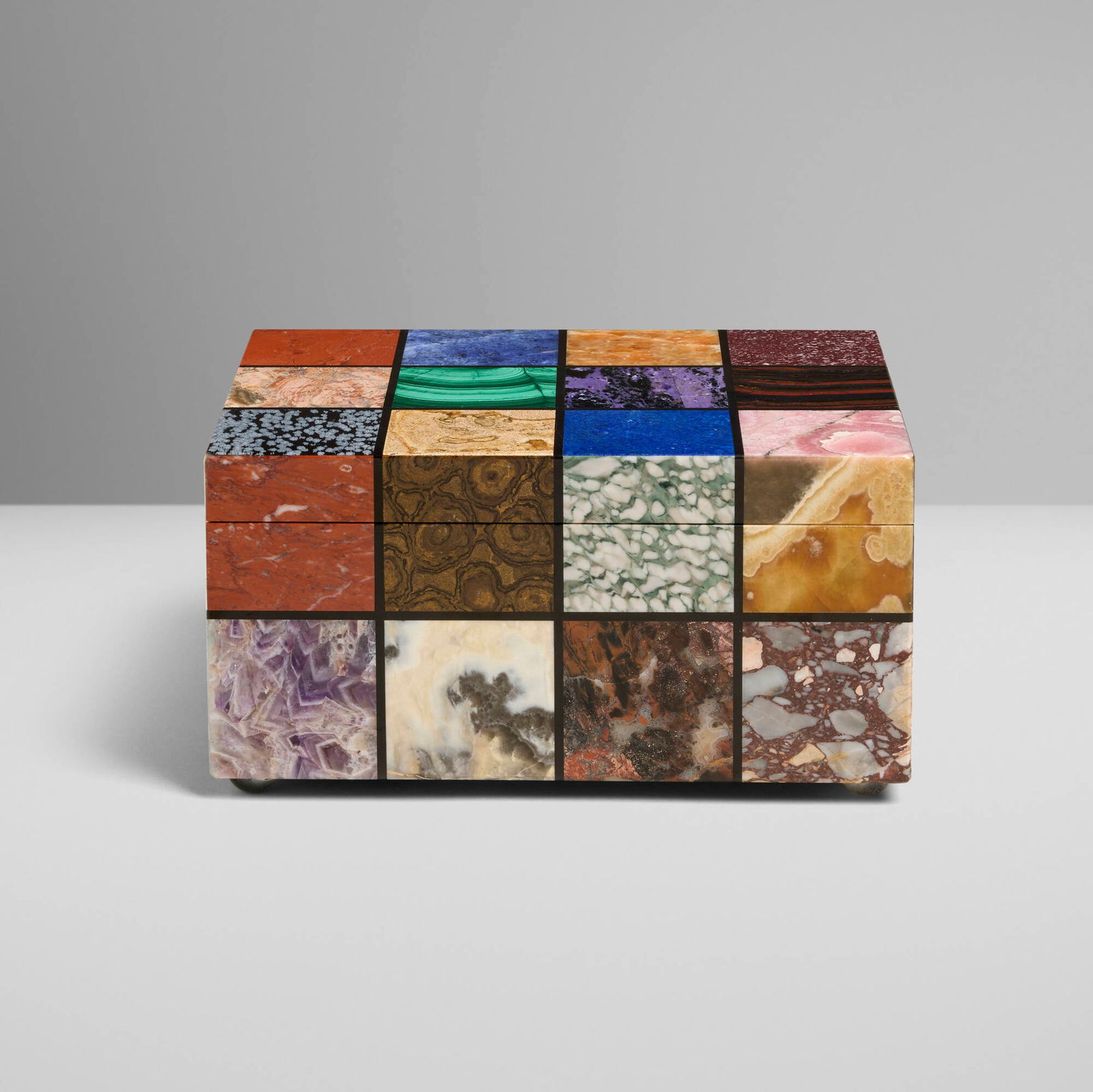 Italian, Lapidary specimen mosaic lidded box: Italian Lapidary specimen mosaic lidded box 20th centuryinlaid semi-precious stones, gilt metal 5 h x 9.625 w x 7.25 d in (13 x 24 x 18 cm) Decal label to underside 'Made in Italy'.