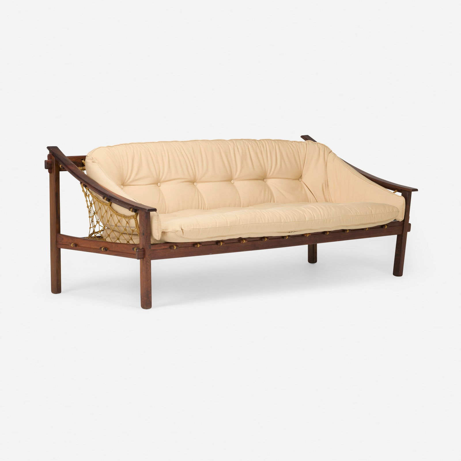 Jean Gillon, Amazonas sofa: Jean Gillon Amazonas sofa Italma Wood ArtBrazil, c. 1965jacaranda, upholstered cushion, rope 28 h x 71.5 w x 33 d in (71 x 182 x 84 cm) Paper manufacturer's label to underside 'Italma Wo