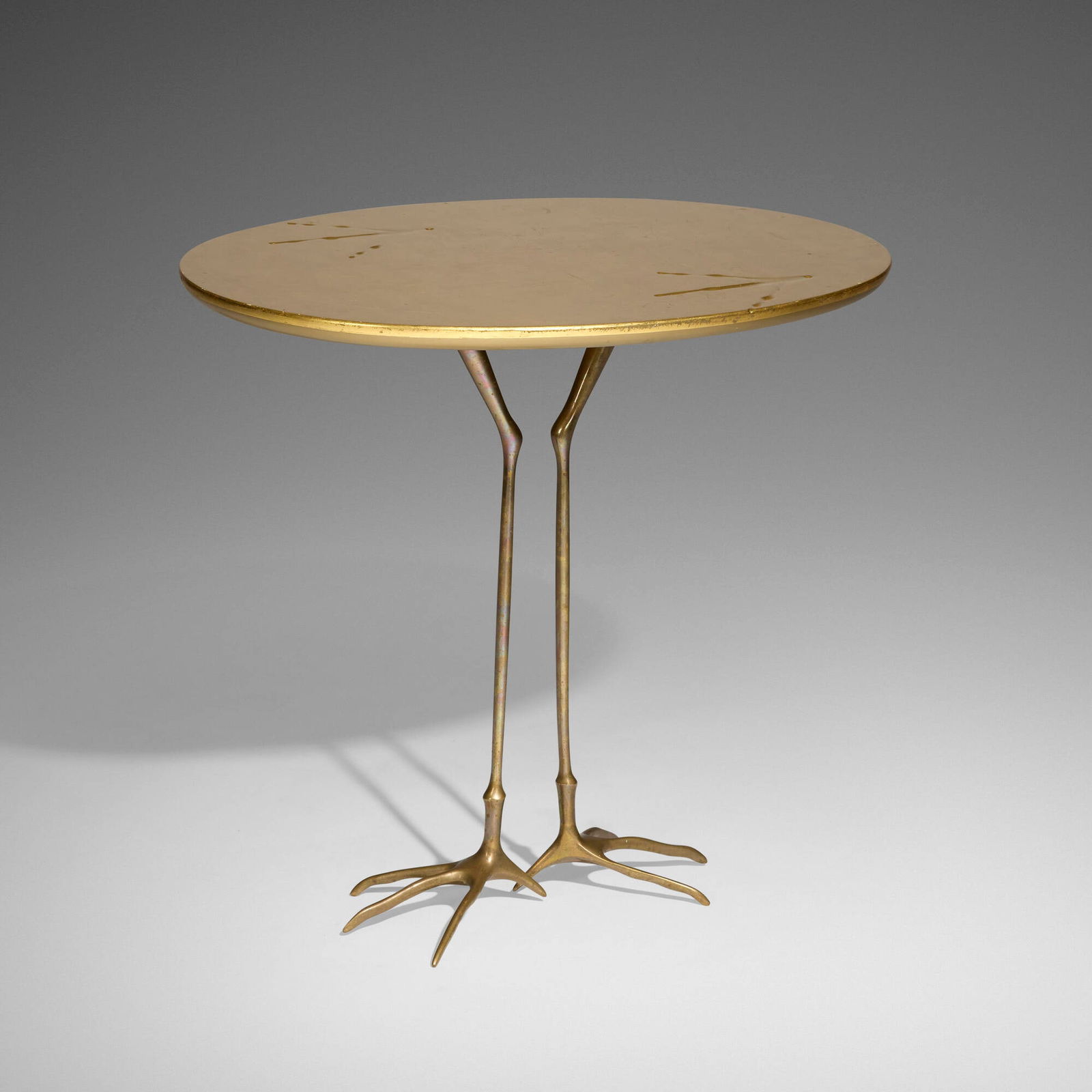 Meret Oppenheim, Traccia table from the Ultramobile collection: Meret Oppenheim Traccia table from the Ultramobile collection Simon GavinaSwitzerland / Italy, 1939 / 1971gold leaf over wood, bronze 25 h x 26.75 w x 20.75 d in (63 x 68 x 53 cm) Metal