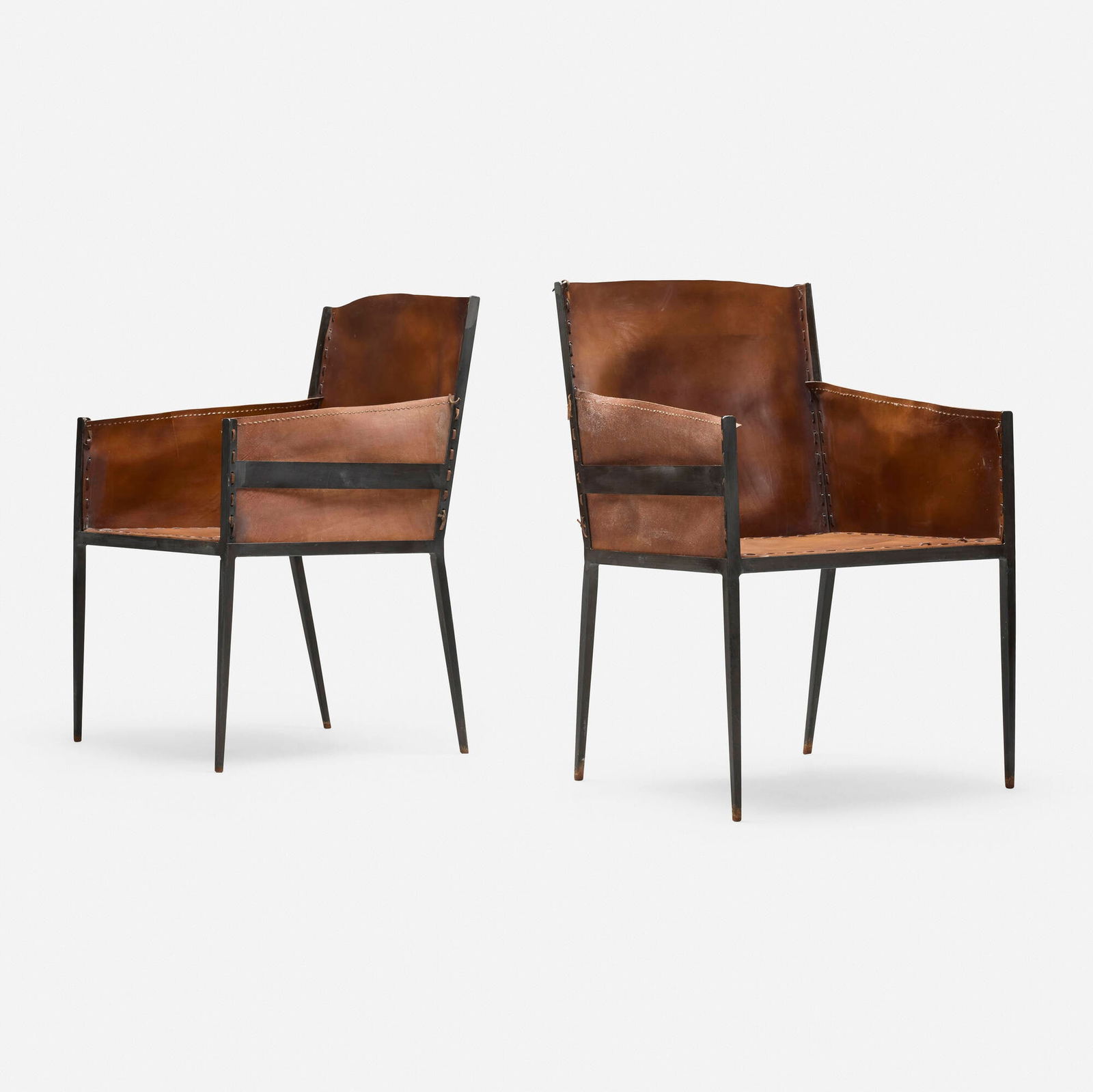 Jean-Michel Frank, Armchairs, pair: Jean-Michel Frank Armchairs, pair ComteFrance / Argentina, c. 1939leather, painted wrought iron 35.75 h x 23.5 w x 23.5 d in (91 x 60 x 60 cm) Metal manufacturer's label to underside of