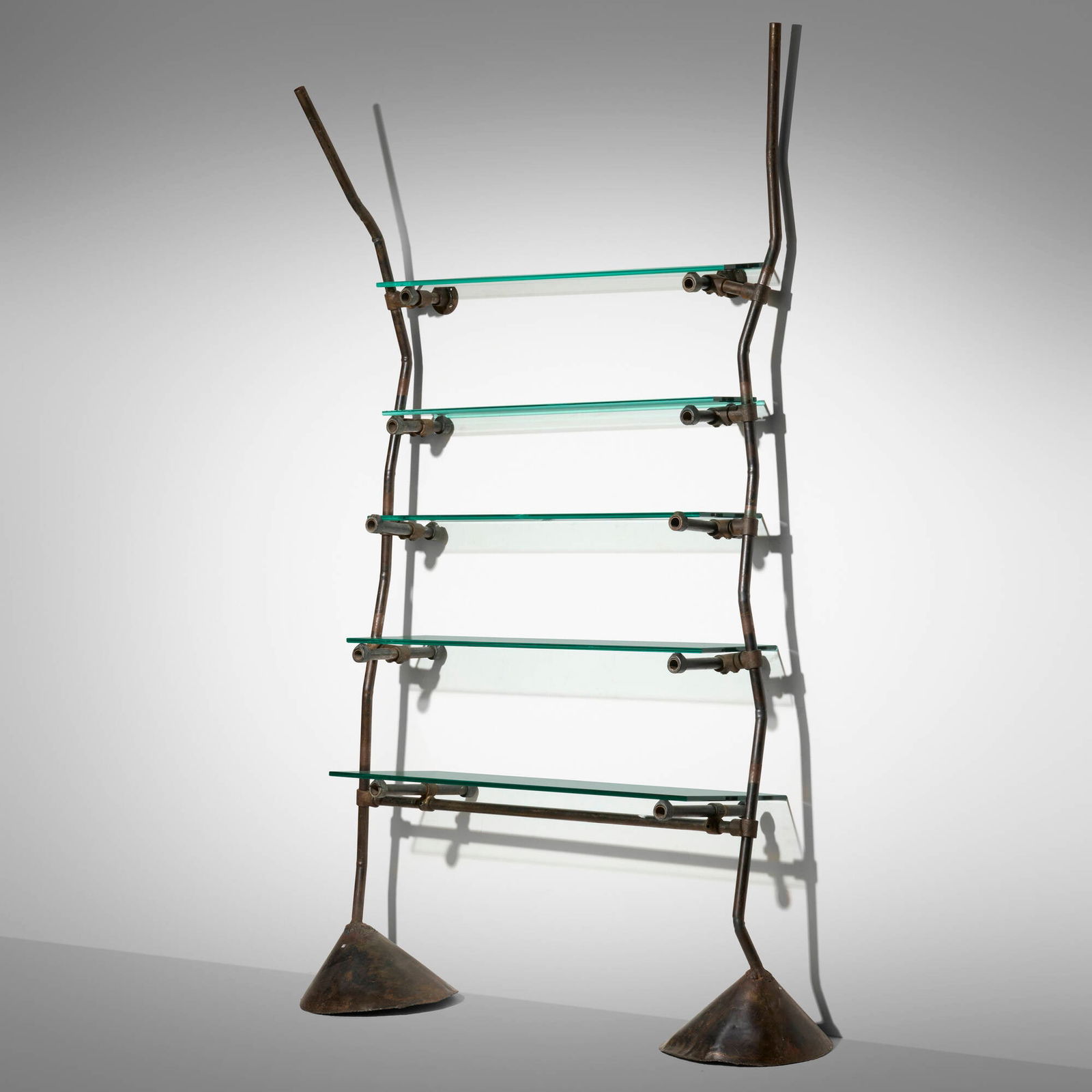 Ron Arad, Unique custom shelf from Bazaar, London: Ron Arad Unique custom shelf from Bazaar, London One OffUnited Kingdom, 1984patinated steel, cast iron, glass, steel 88 h x 55 w x 16 d in (224 x 140 x 41 cm) Unit features five adjustab