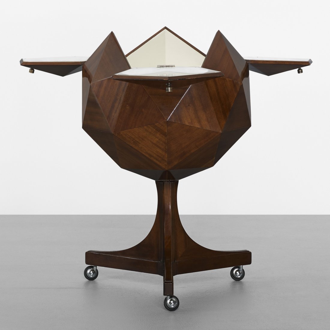 Ico and Luisa Parisi, attribution Rolling bar: Ico and Luisa Parisi, attribution Rolling bar Italy, c. 1960 mahogany, laminate, lacquered wood, brass, steel 24.5 w x 26 d x 41.5 h inches This polyhedron-shaped bar features three doors concealing s