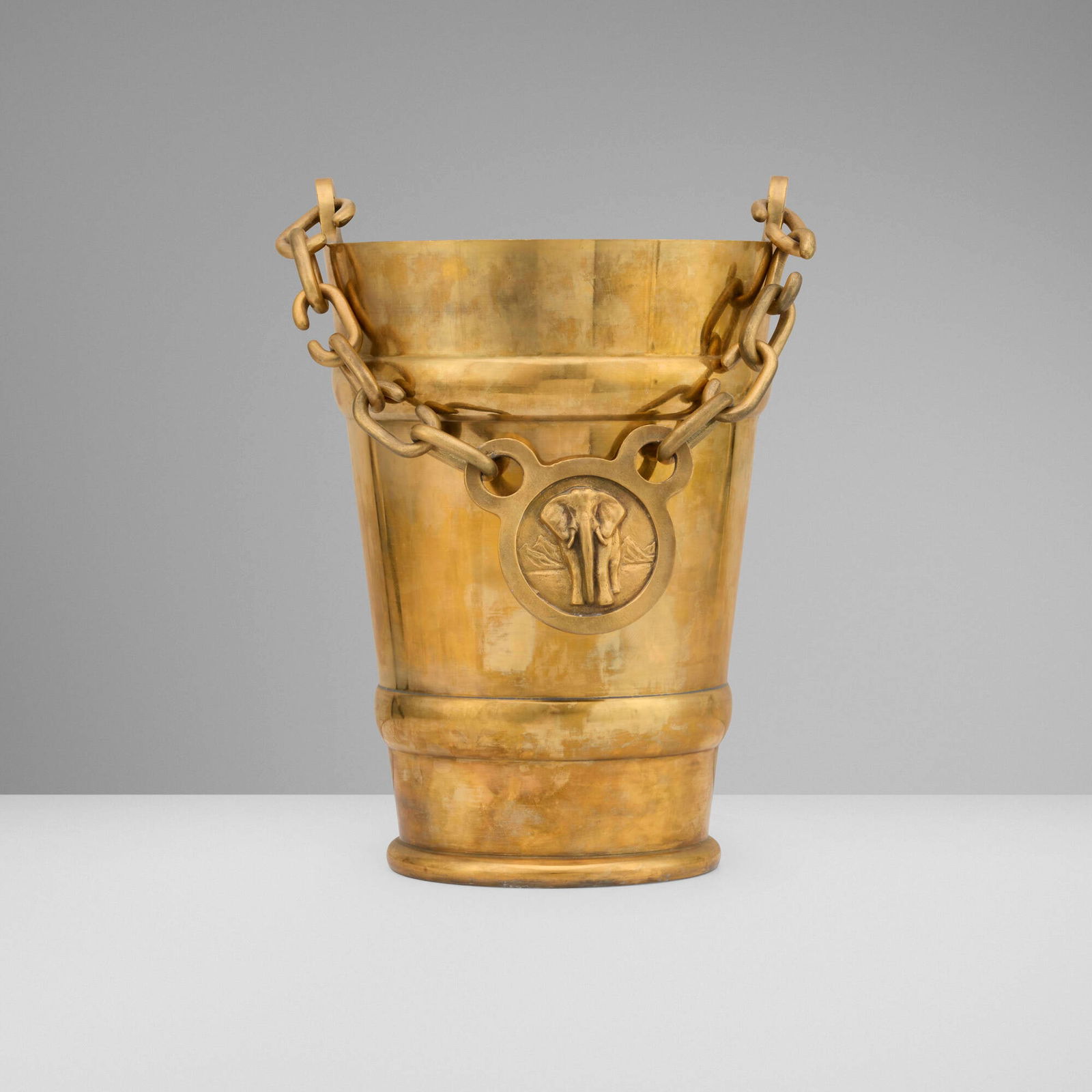 Studio Job, Ice bucket with elephant pendant: Studio Job Ice bucket with elephant pendant Belgium, c. 1960gilt tin and pewter 11.75 h x 8.75 w x 7.5 d in (30 x 22 x 19 cm) Impressed signature and number to underside 'JOB 07 2/8' and manuf