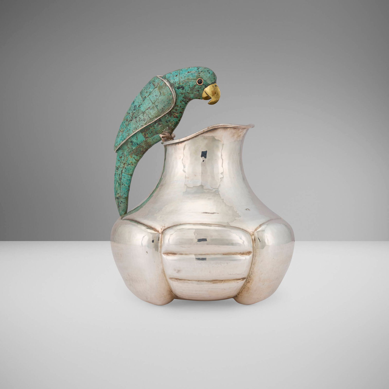 Emilia Castillo, Parrot pitcher: Emilia Castillo Parrot pitcher Mexico, c. 1990silver-plated metal, malachite, brass 11.25 h x 10.5 w x 10 d in (29 x 27 x 25 cm) Impressed signature to underside 'Emilia Castillo Mexico M.R. P