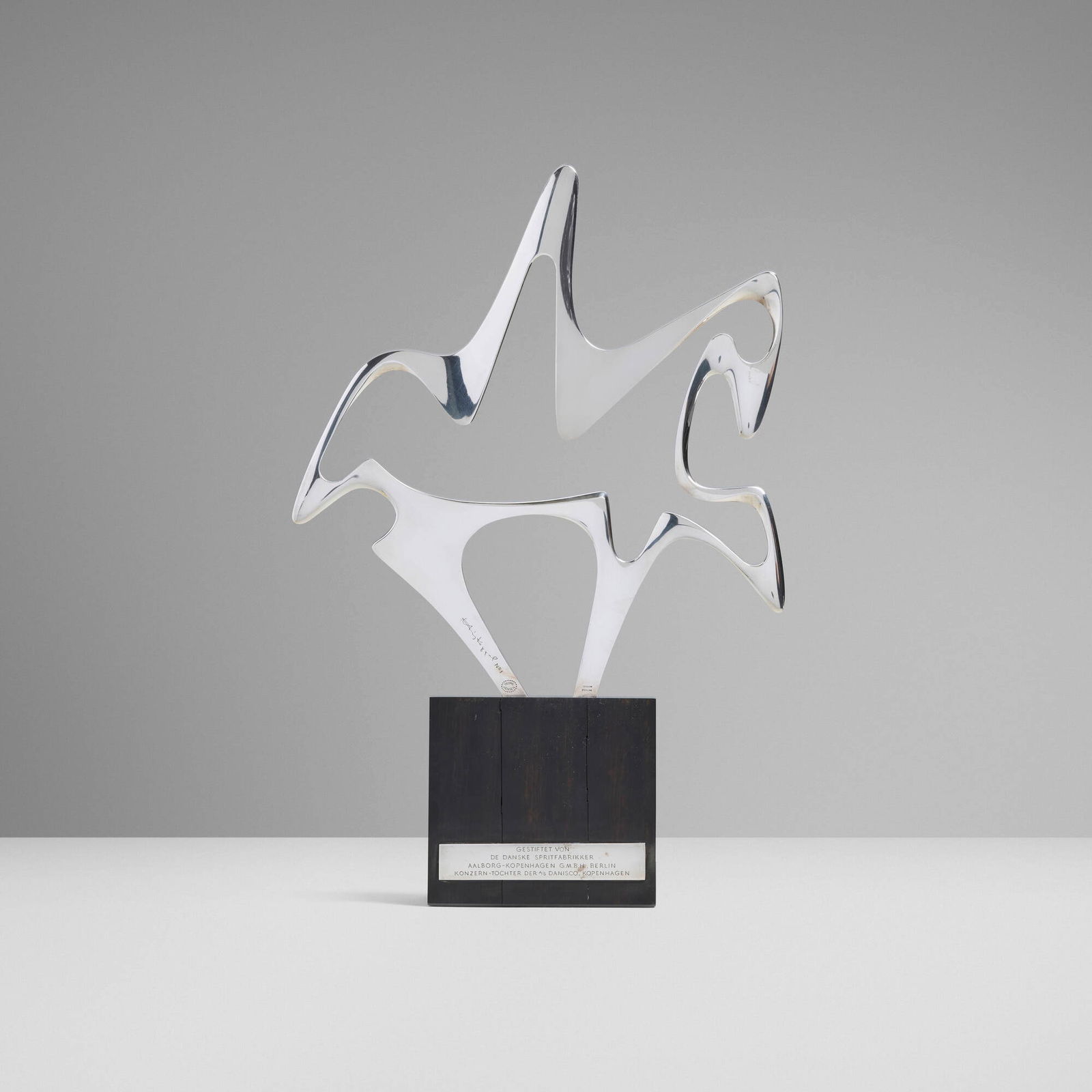 Henning Koppel, Abstract horse sculpture: Henning Koppel Abstract horse sculpture Georg JensenDenmark, c. 1974sterling silver, wood 17.25 h x 11.5 w x 3.5 d in (44 x 29 x 9 cm) The present work was given as an equestrian trophy.