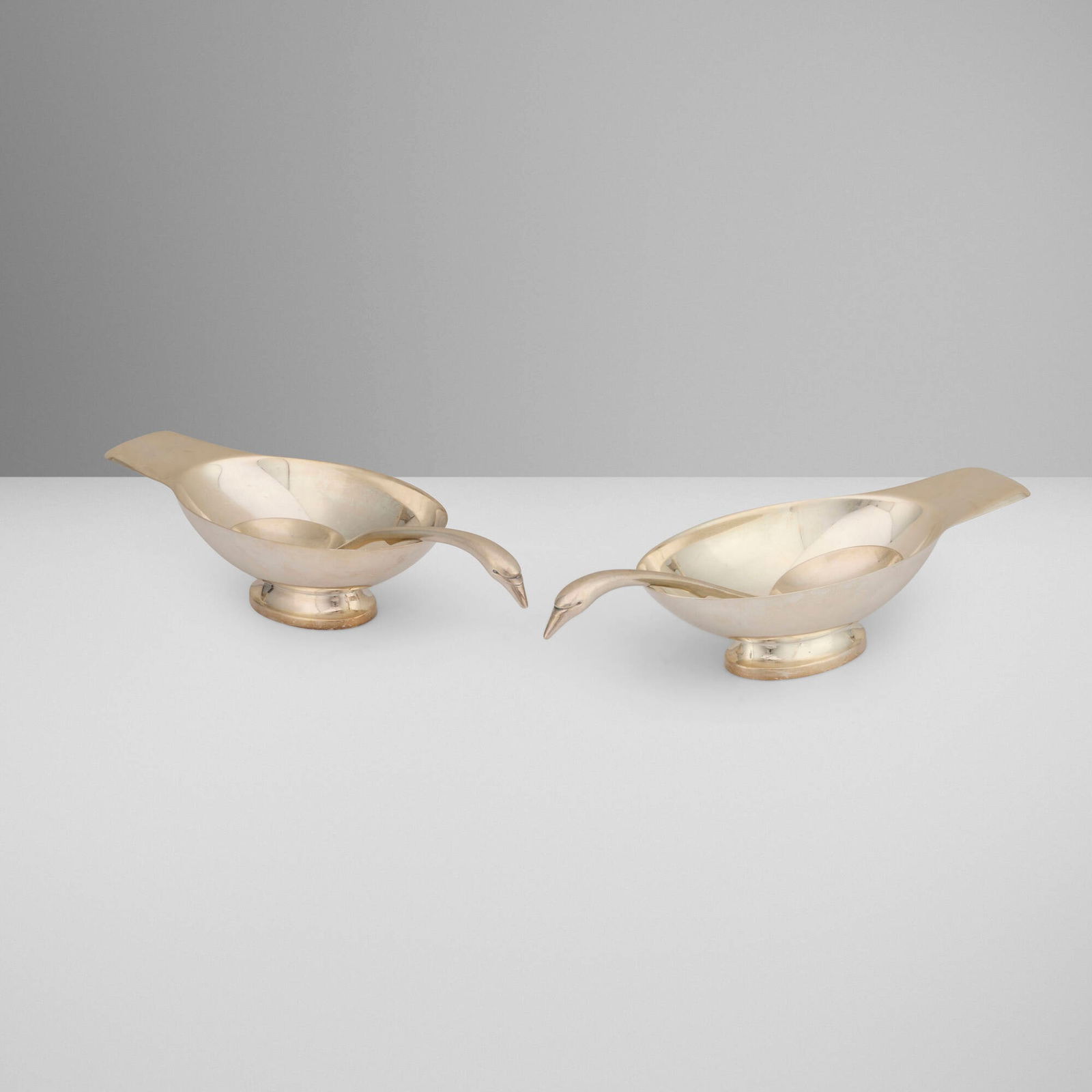 Christian Fjerdingstad, Cygne gravy boats with ladles, pair: Christian Fjerdingstad Cygne gravy boats with ladles, pair ChristofleDenmark / France, c. 1935 / c. 1990silver-plated metal 2.25 h x 8.5 w x 3.875 d in (6 x 22 x 10 cm) 1.25 h x 8 w x 1.875