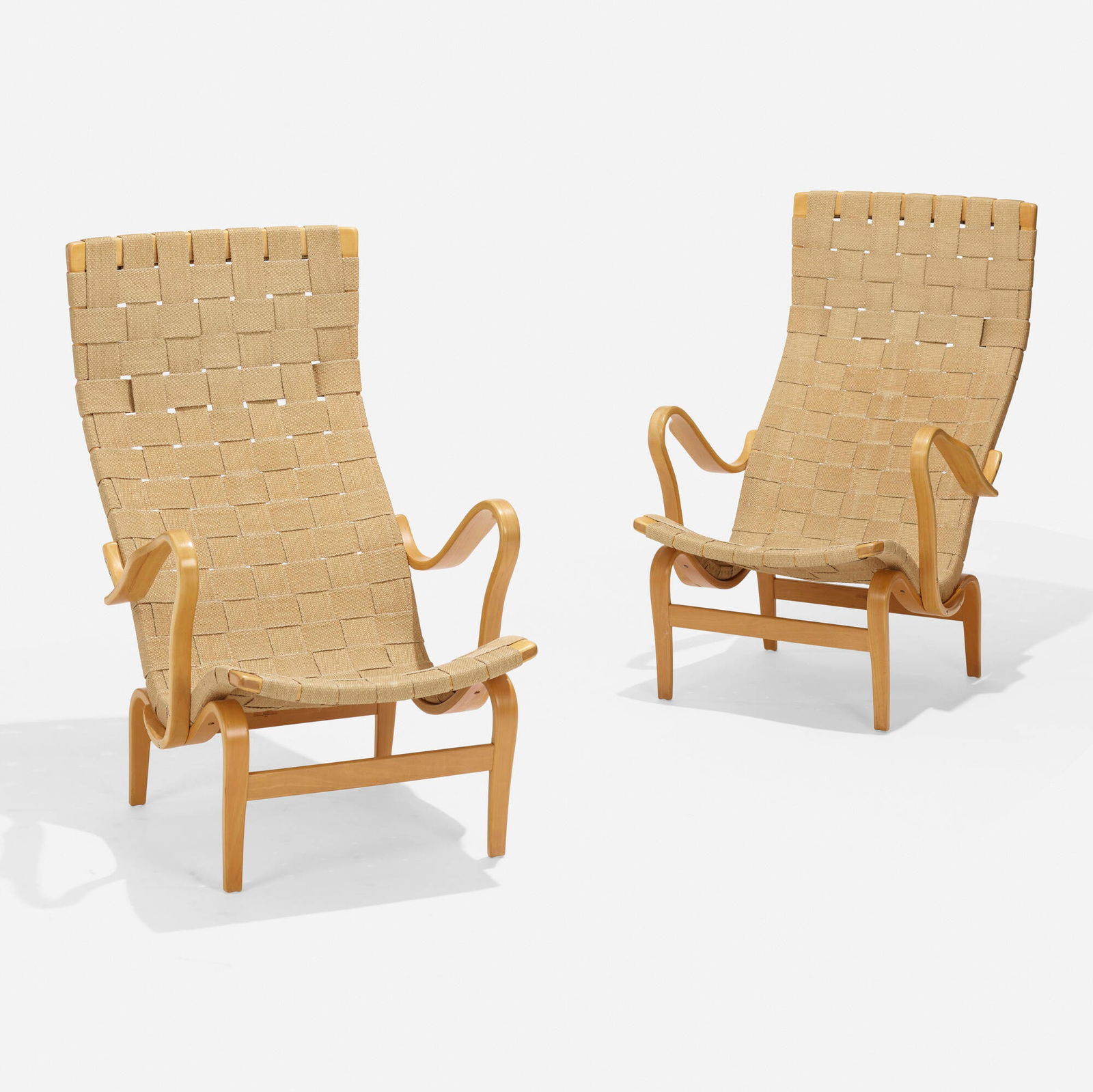 Bruno Mathsson, Pernilla 2 lounge chairs, pair: Bruno Mathsson Pernilla 2 lounge chairs, pair Firma Karl MathssonSweden, 1944 / 1976laminated and steam-bent beech, canvas webbing 39.74 h x 25.5 w x 34 d in (101 x 65 x 86 cm) Branded m