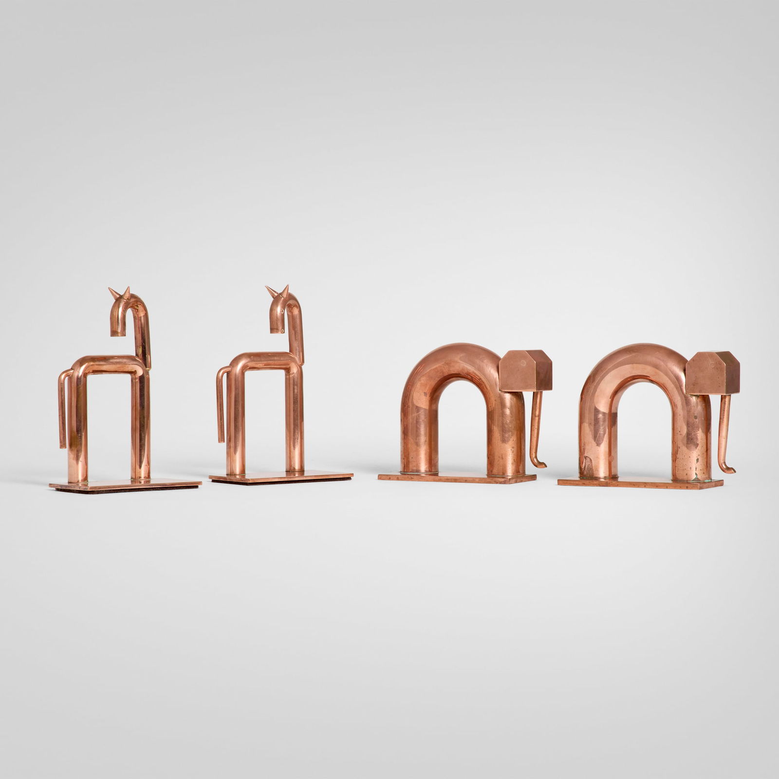 Chase Brass & Copper Co., Collection of bookends, two pairs: Chase Brass & Copper Co. Collection of bookends, two pairs USA, c. 1930copper-plated brass horse: 6.25 h x 4 w x 2.5 d in (16 x 10 x 6 cm) elephant: 4.25 h x 5.5 w x 2 d in (11 x 14 x 5 cm)