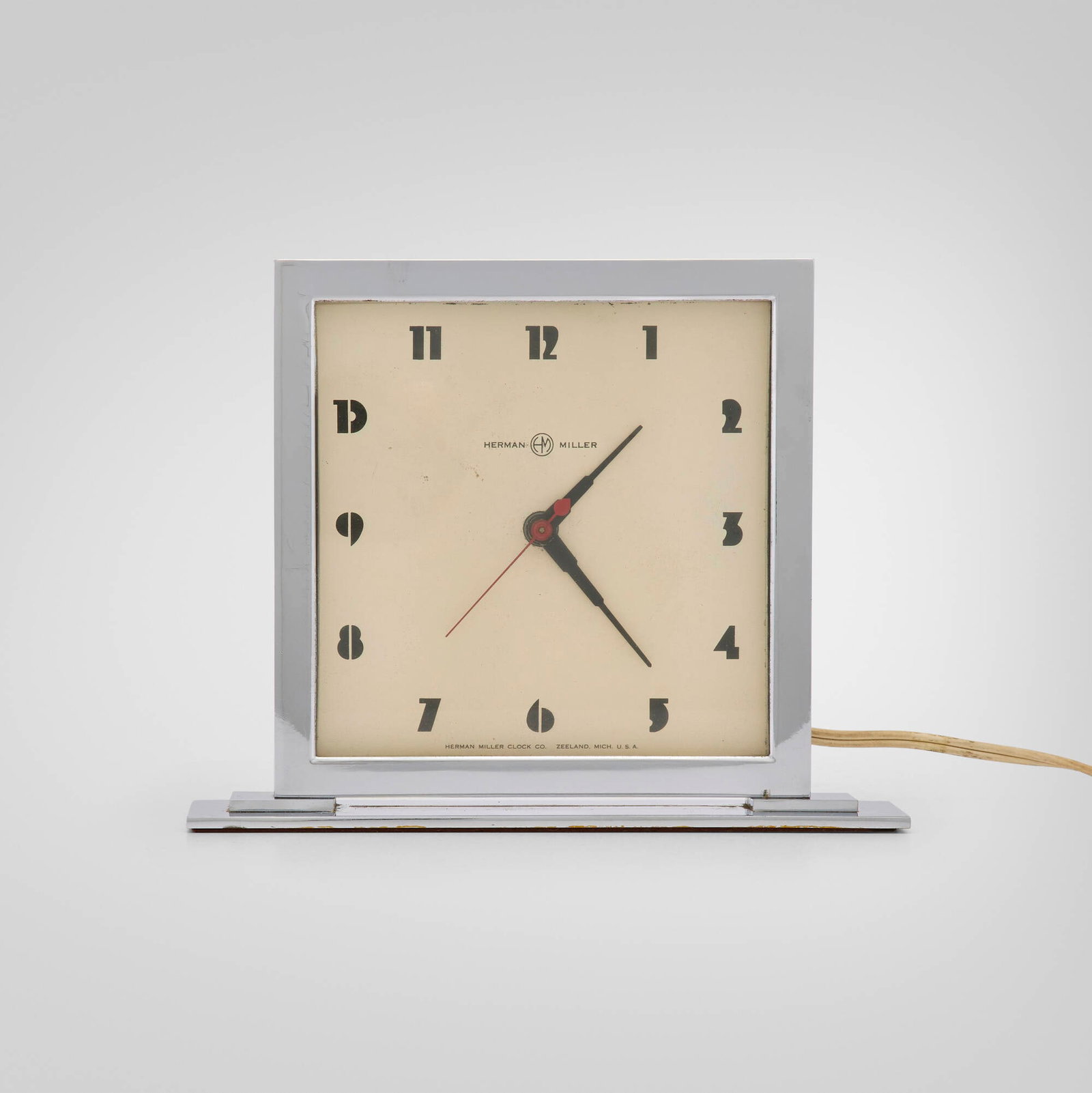Gilbert Rohde, Table clock: Gilbert Rohde Table clock Herman Miller Clock CompanyUSA, c.1935I would suggest chrome-plated aluminum and steel, glass, enameled aluminum 6.5 h x 8 w x 2 d in (17 x 20 x 5 cm) Printed m