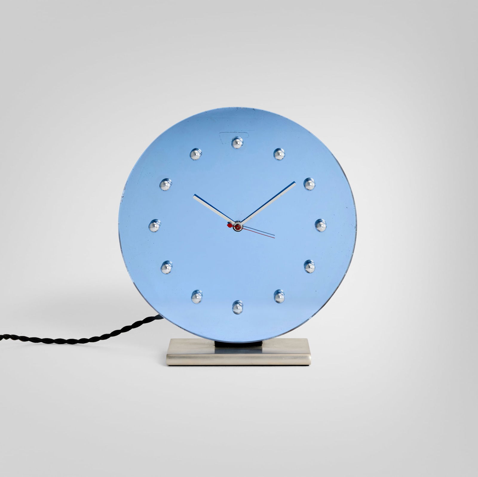 Gilbert Rohde, Table clock, model 4083A: Gilbert Rohde Table clock, model 4083A Herman Miller Clock CompanyUSA, 1933mirrored glass, steel 11 h x 10 w x 3.5 d in (28 x 25 x 9 cm) Literature: The Herman Miller