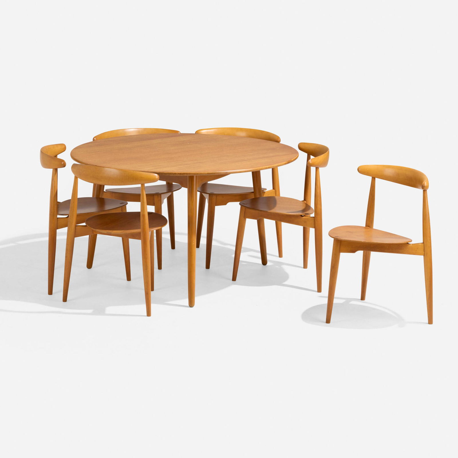 Hans J. Wegner, Dining suite: Hans J. Wegner Dining suite Fritz HansenDenmark, c. 1966beech, oak plywood table: 28 h x 47 dia in (71 x 119 cm) chair: 28.25 h x 20.75 w x 18 d in (72 x 53 x 46 cm) Suite is comprise