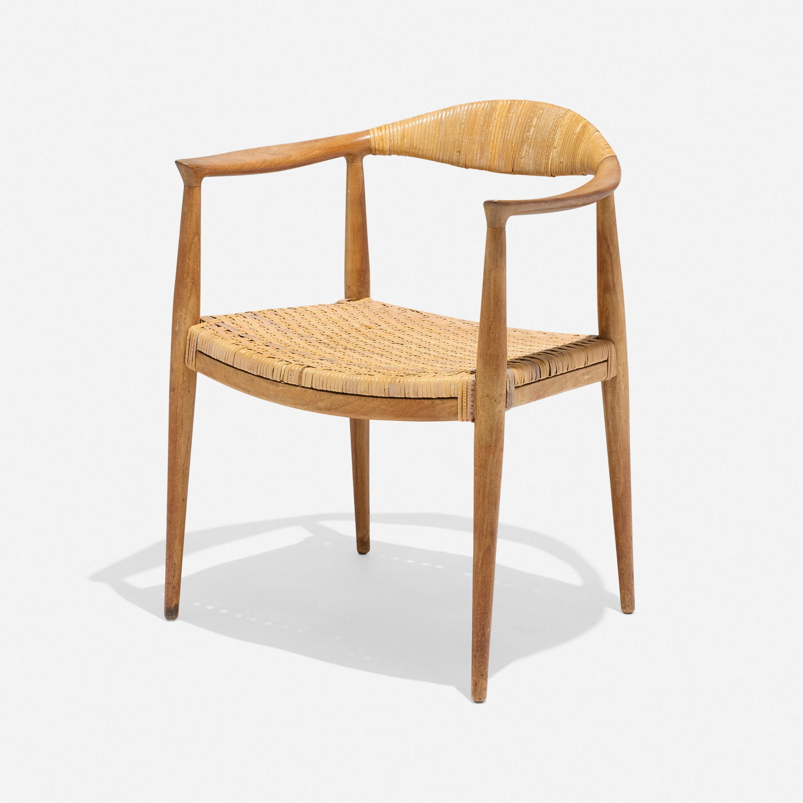 Hans J. Wegner, The Chair: Hans J. Wegner The Chair Johannes HansenDenmark, 1949 / c. 1960teak, cane 29.75 h x 24.75 w x 21 d in (76 x 63 x 53 cm) Literature: Hans J. Wegner, Bernsen, pg. 7