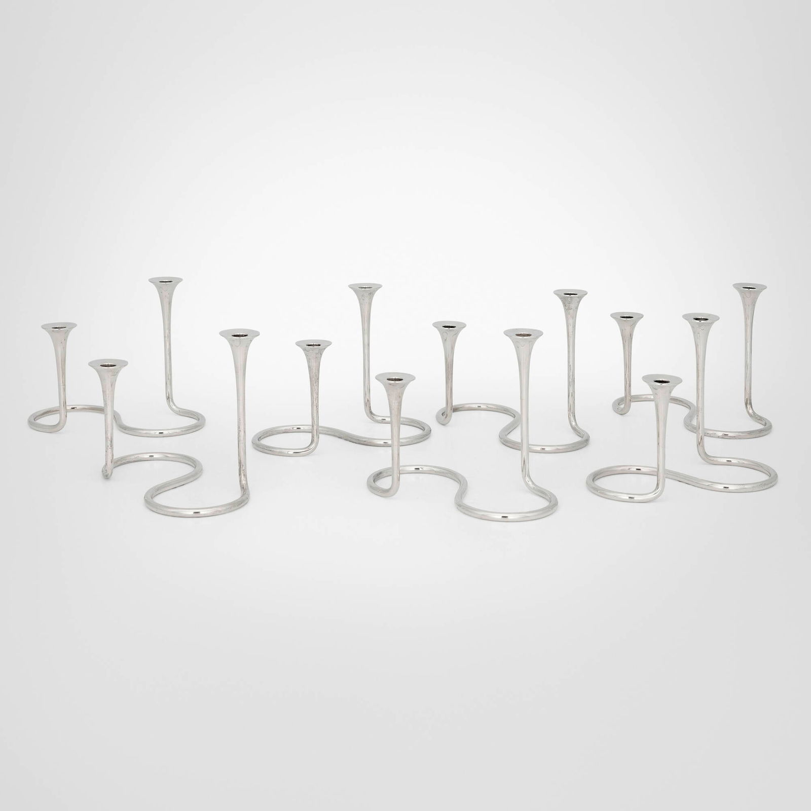 Eigil Jensen, Candlesticks, set of seven: Eigil Jensen Candlesticks, set of seven A. MichelsenDenmark, c. 1950sterling silver 4.75 h x 6.375 w x 3.25 d in (12 x 16 x 8 cm) Impressed manufacturer's mark to underside of each examp