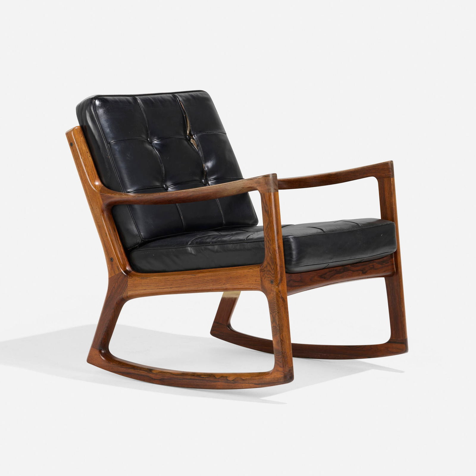 Ole Wanscher, Rocking chair: Ole Wanscher Rocking chair France & SonDenmark, 1964rosewood, leather upholstery 29.5 h x 26.5 w x 28 d in (75 x 67 x 71 cm) Metal manufacturer's label and gilt mark to interior of back