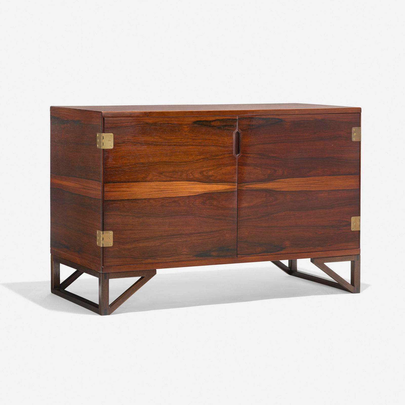 Svend Langkilde, Cabinet: Svend Langkilde Cabinet Langkilde MoblerDenmark, c. 1960rosewood, brass 26 h x 39.375 w x 18.5 d in (66 x 100 x 47 cm) Two doors conceal one adjustable shelf and four drawers. Branded ma