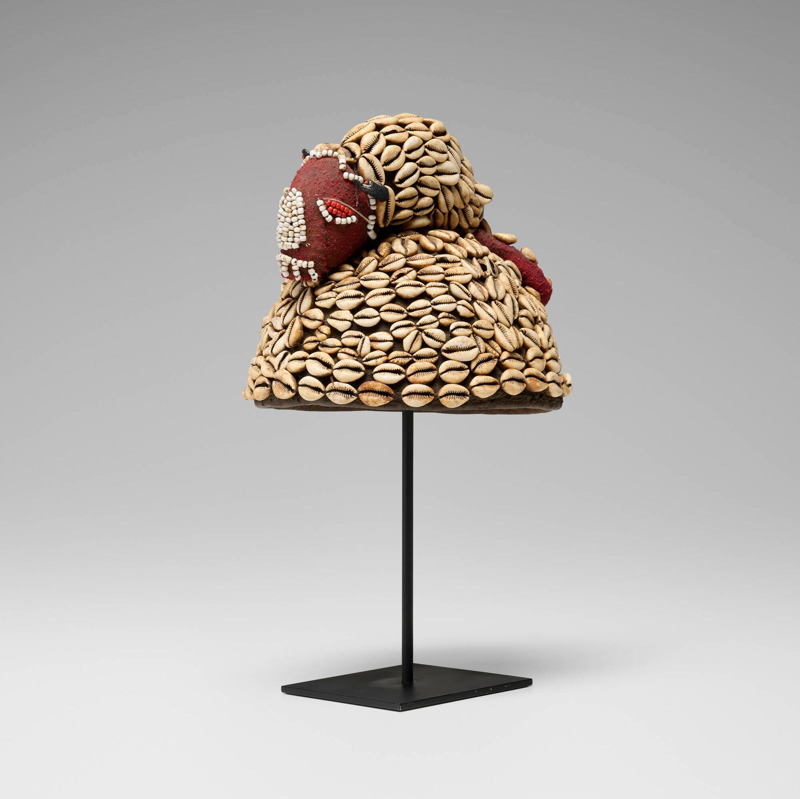 Kuba, Laket (noble's hat) with rodent: Kuba Laket (noble's hat) with rodent Democratic Republic of the Congo, 20th centuryCowrie shells, beads, fiber 9 h x 8.5 dia in (23 x 22 cm) Provenance: Collection of Howard a