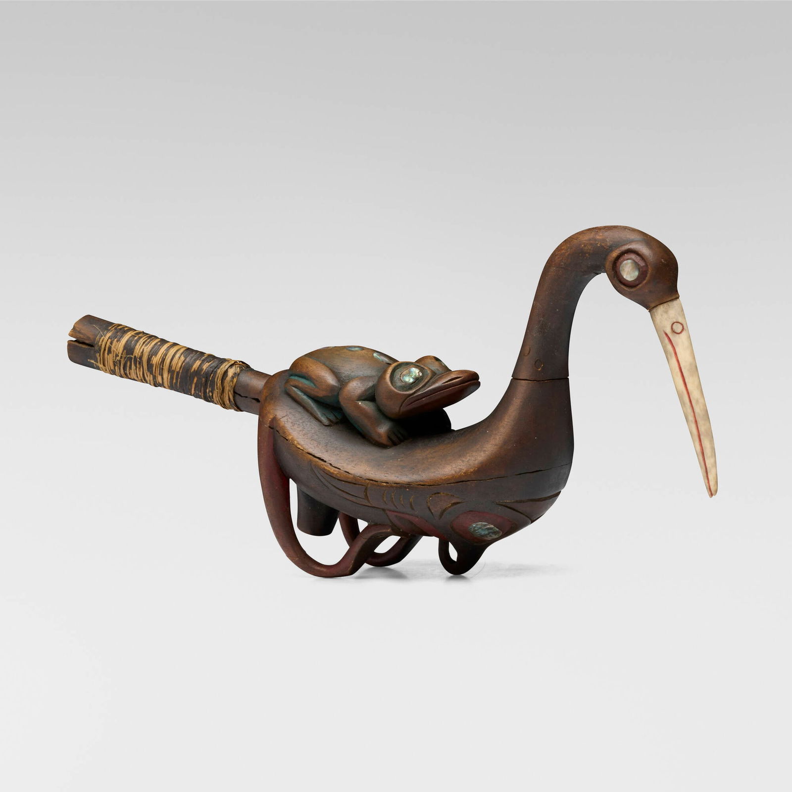 Tlingit, Oystercatcher rattle: Tlingit Oystercatcher rattle Coastal Southwest Alaskawood, bone, abalone shell, jute, paint 9 h x 13 w x 4.5 d in (23 x 33 x 11 cm) Provenance: Collection of Joanne S. Levenso