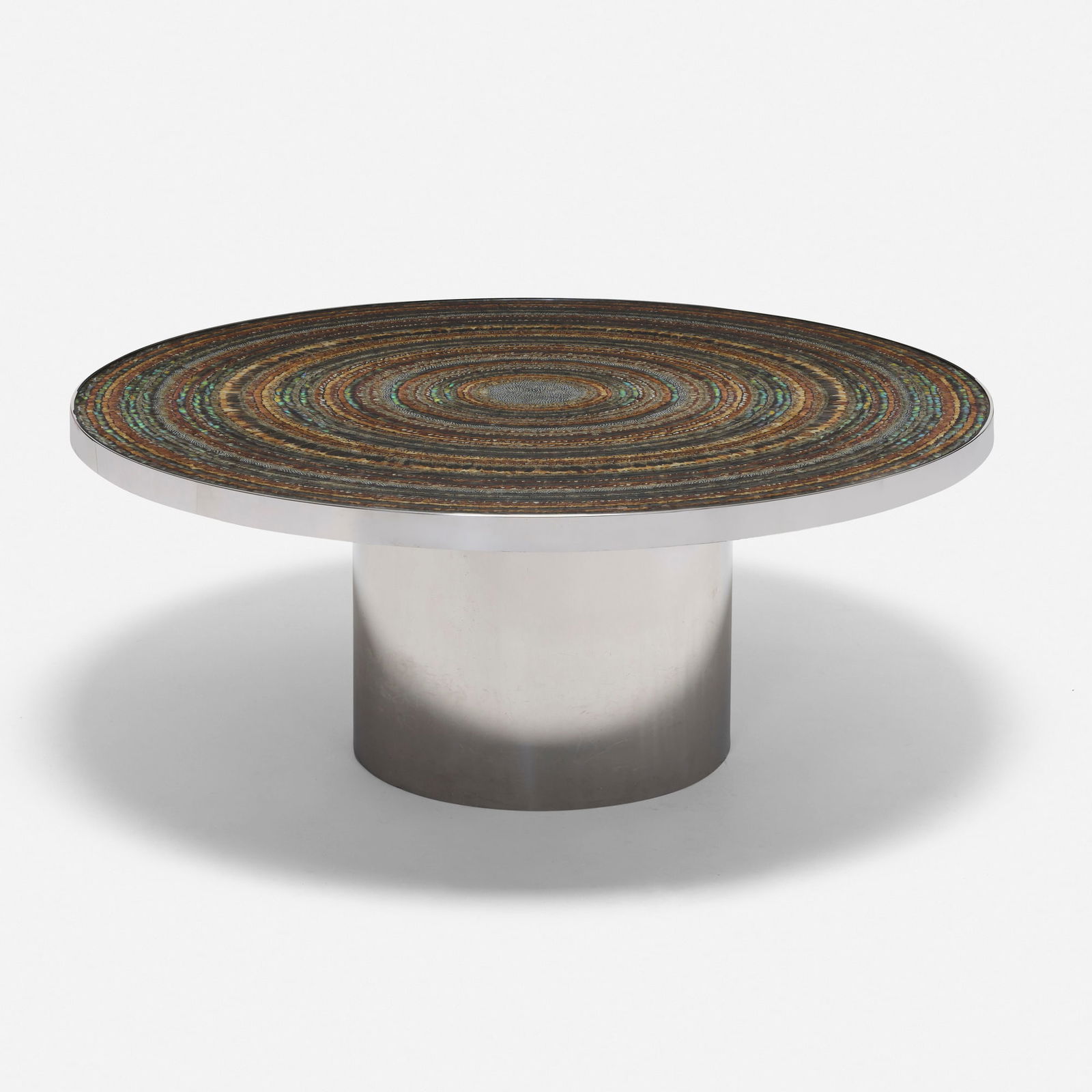 Karl Springer, Rare Custom dining table: Karl Springer Rare Custom dining table USA, c. 1972polished stainless steel, feathers, glass, painted wood 29.25 h x 72 dia in (74 x 183 cm) Dining table features a custom, hand-made feather i