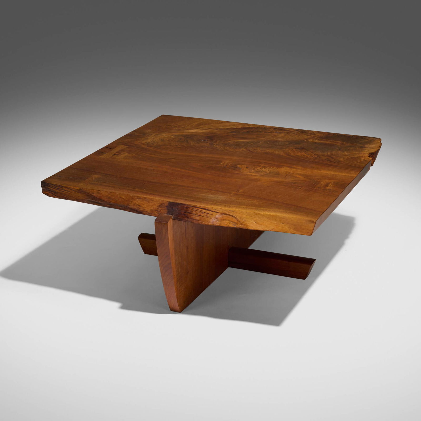 Mira Nakashima, Greenrock coffee table: Mira Nakashima Greenrock coffee table Nakashima StudioUSA, 1996American black walnut, rosewood 15.25 h x 39.25 w x 36 d in (39 x 100 x 91 cm) Proceeds from the sale of this work will ben