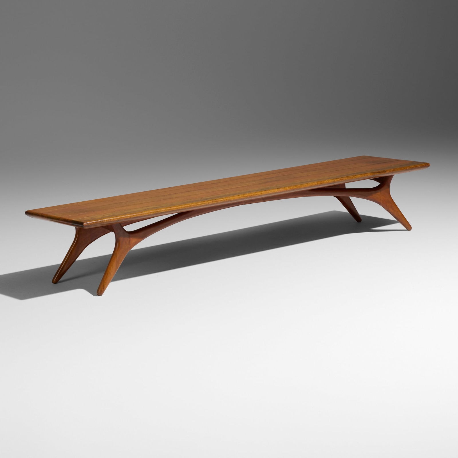 Vladimir Kagan, Bench: Vladimir Kagan Bench Grosfeld HouseUSA, c. 1950walnut 11.75 h x 72 w x 17 d in (30 x 183 x 43 cm) Literature: The Complete Kagan: A Lifetime of Avant-Garde Design