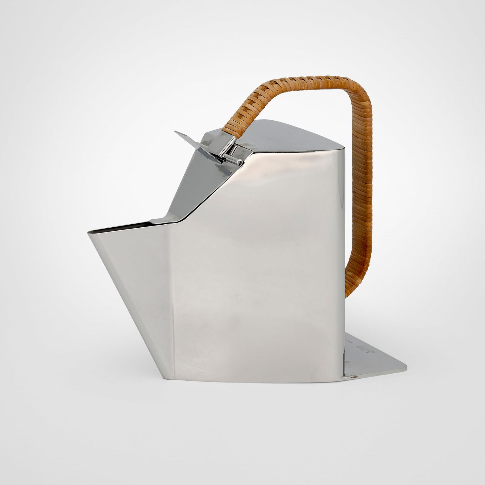 Richard Sapper, Bandung teapot: Richard Sapper Bandung teapot AlessiGermany / Italy, 1990polished stainless steel, wicker 8 h x 8.75 w x 4.75 d in (20 x 22 x 12 cm) Impressed manufacturer's mark to reverse 'Officina Al