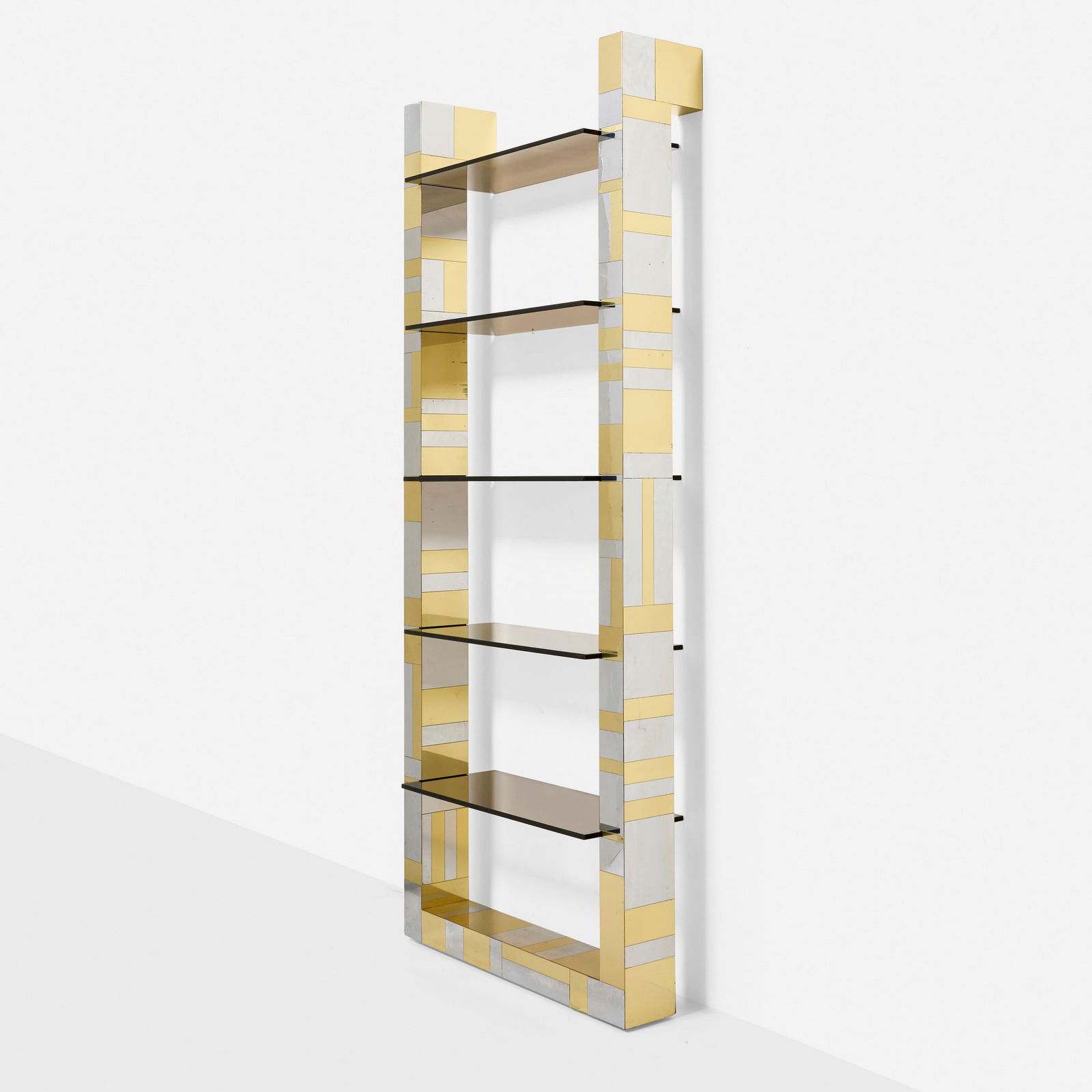 Paul Evans, Cityscape wall-mounted bookshelf from the PE 200 series: Paul Evans Cityscape wall-mounted bookshelf from the PE 200 series Paul Evans Studio for DirectionalUSA, c. 1975brass, chrome-plated steel, smoked glass 90 h x 37 w x 11.75 d in (229 x 94 x 30