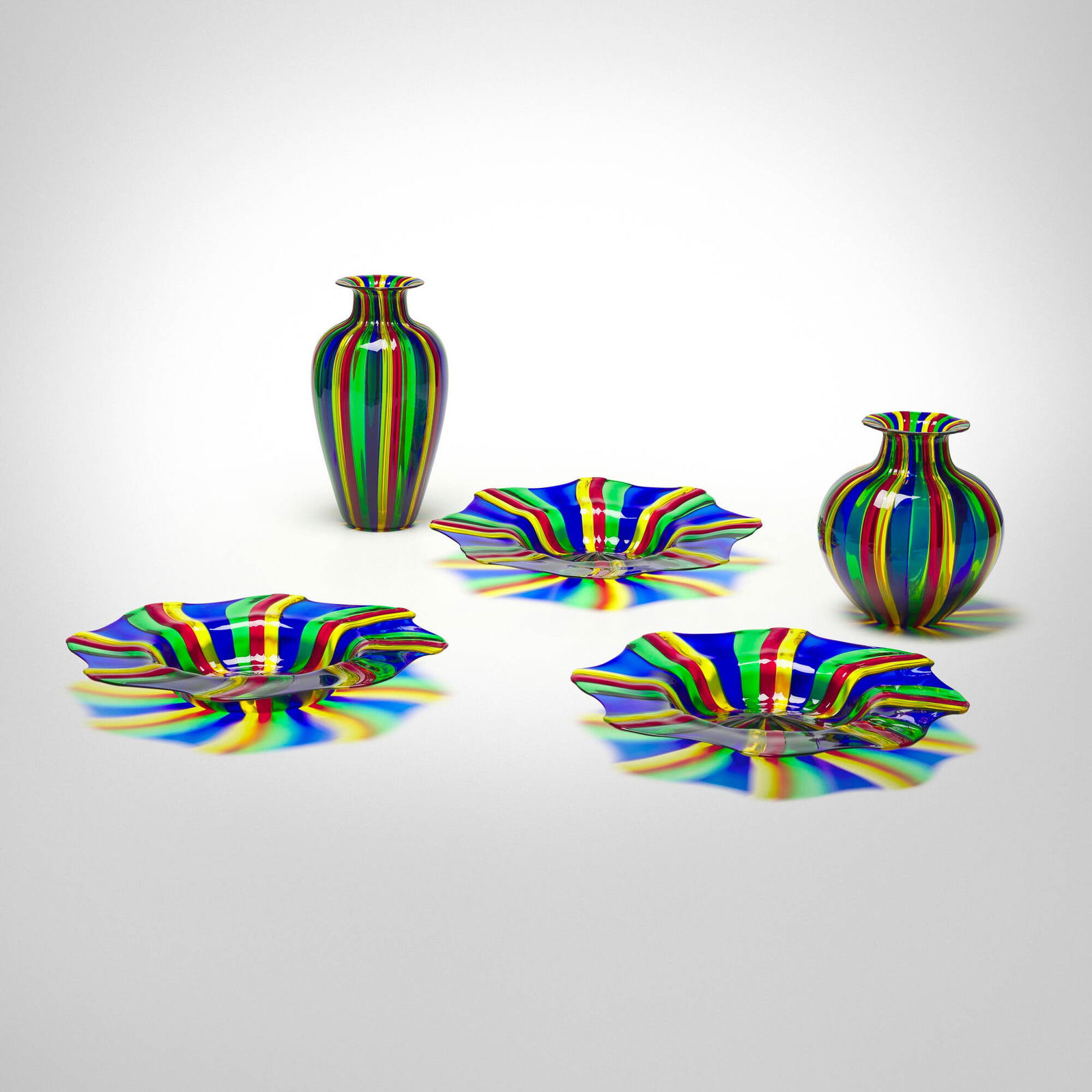 Linea Valentina, Collection of five table accessories: Linea Valentina Collection of five table accessories Italy, 21st centuryfused glass canes 11.75 h x 6.25 dia in (30 x 16 cm) 8.5 h x 7.5 dia in (22 x 19 cm) 2.5 h x 15 dia in (6 x 38 cm)