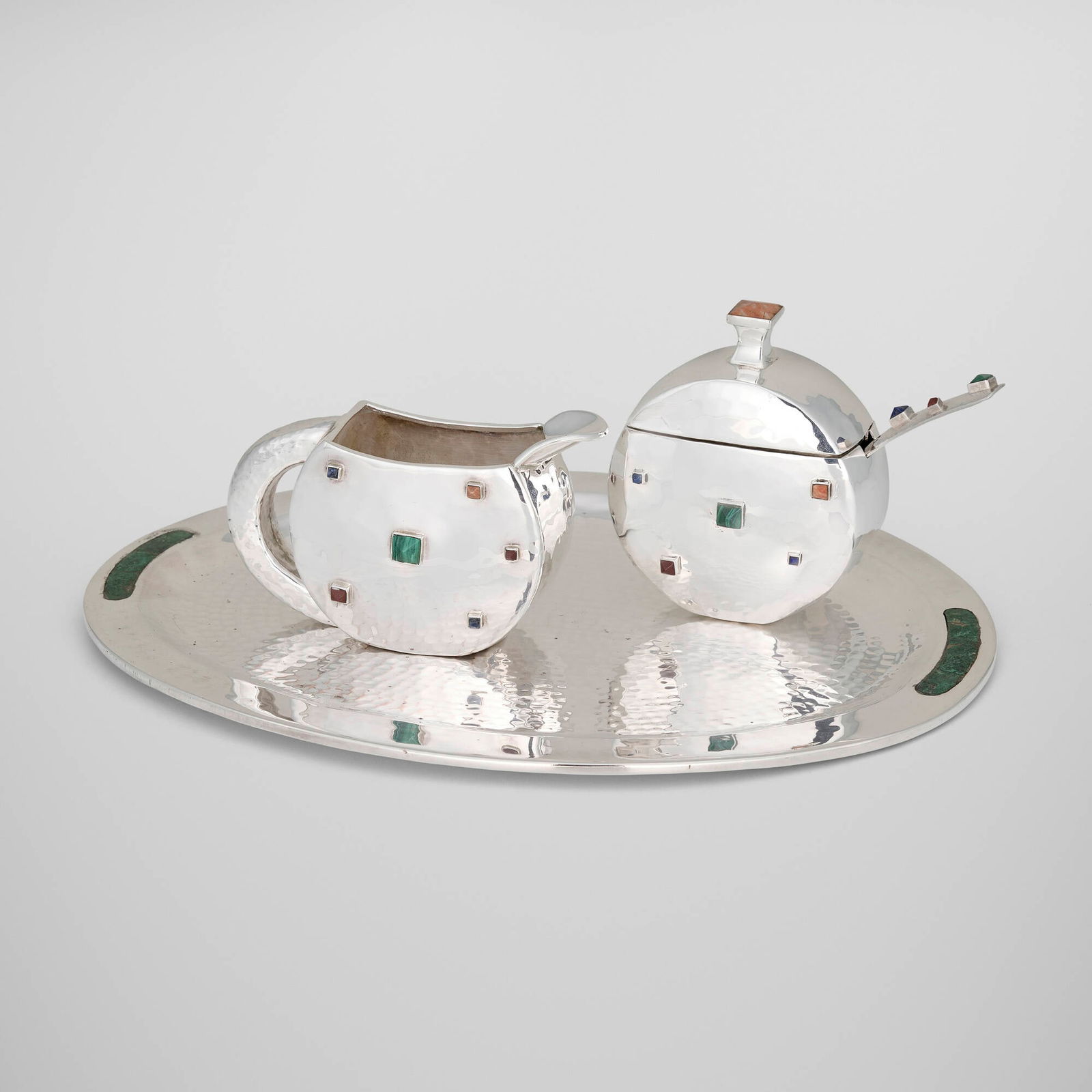 Emilia Castillo, Collection of tabletop articles: Emilia Castillo Collection of tabletop articles Mexico, c. 1995sterling silver, yellow jasper, malachite, lapis lazuli, red jasper, silver-plated metal, hardstone inlay largest: 11.75 h x 8.75 w x 0.