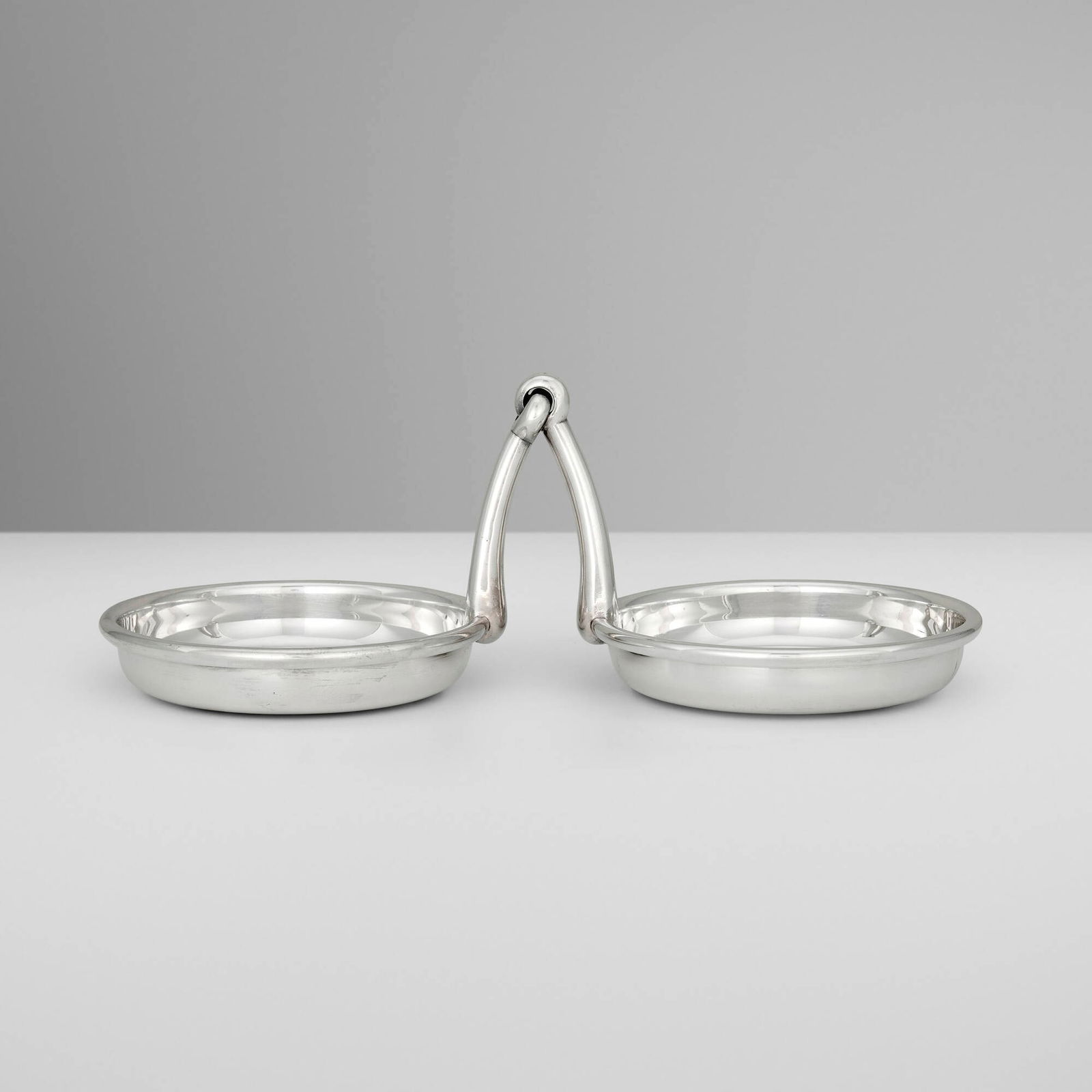 Hermes, Horse Bit double catchall: Hermes Horse Bit double catchall Ravinet d'Enfert & CieFrance, c. 1965silver-plated metal 4.25 h x 11.5 w x 5.25 d in (11 x 29 x 13 cm) Impressed manufacturer's mark to edge of one examp