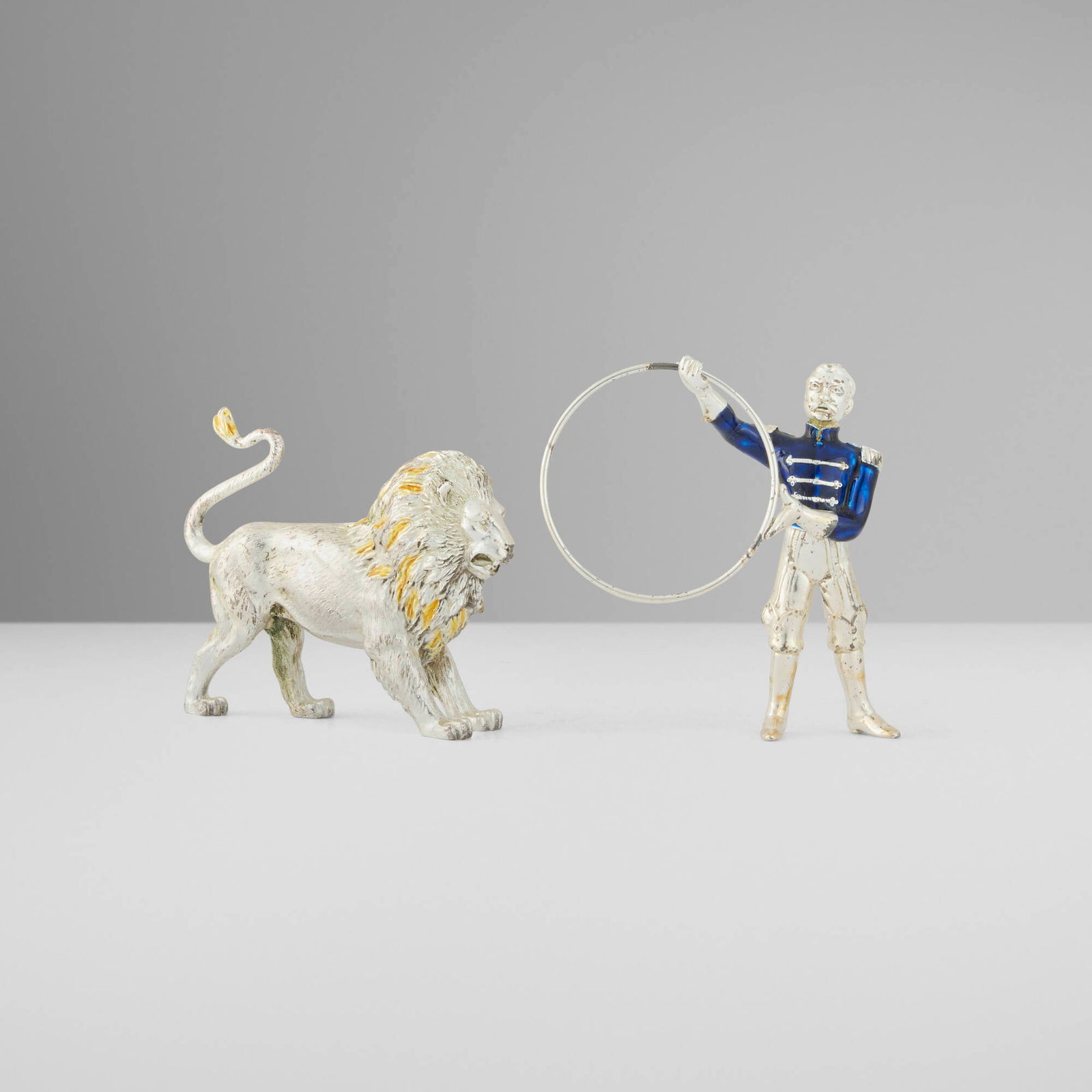 Gene Moore for Tiffany & Co., Circus lion and tamer: Gene Moore for Tiffany & Co. Circus lion and tamer USA / Italy, 1988-1990enameled sterling silver 3.5 h x 3 w x 1.25 d in (9 x 8 x 3 cm) 2.625 h x 3.375 w x 1.125 d in (7 x 9 x 3 cm) Impres