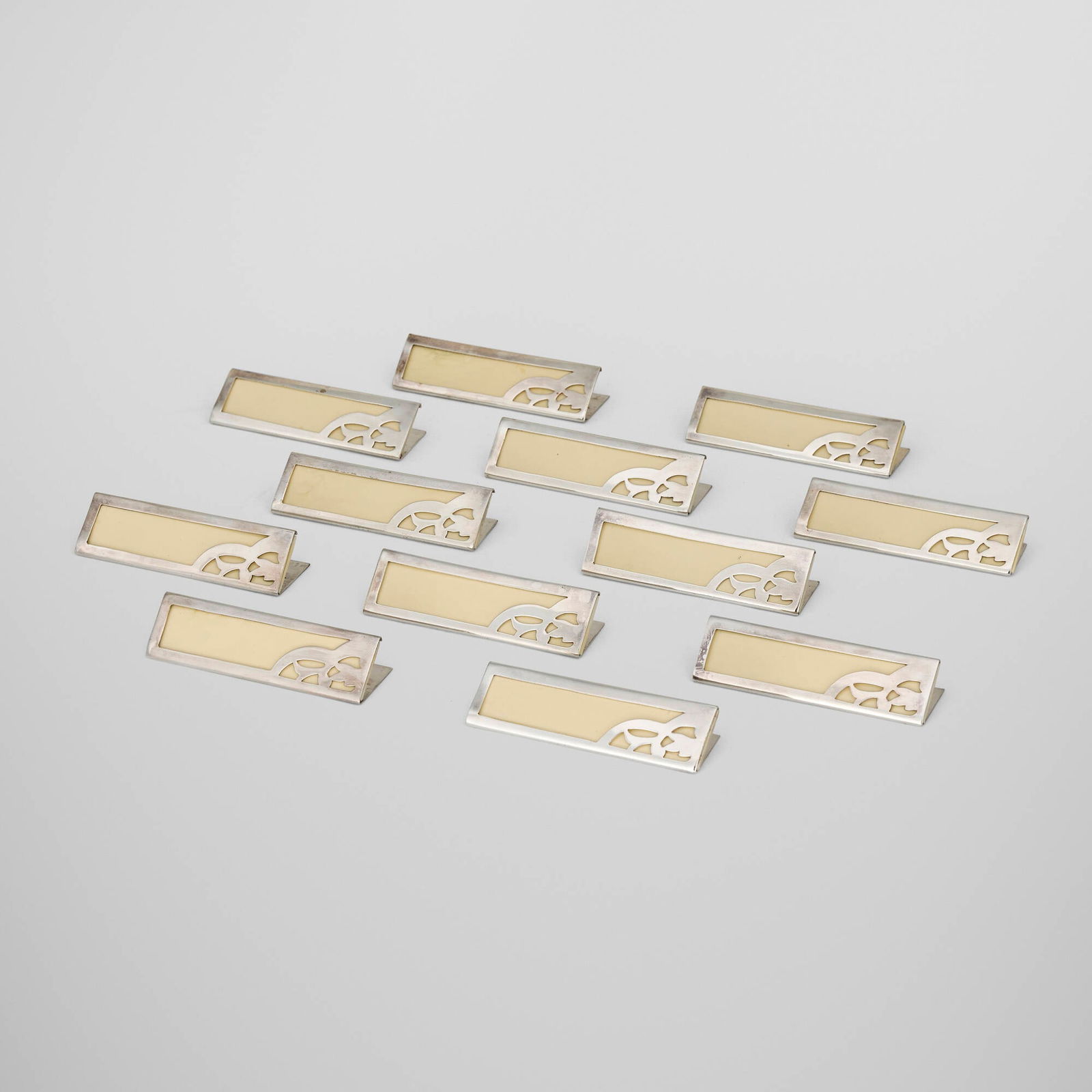 French, Blank place cards, set of twelve: French Blank place cards, set of twelve c. 1950silver-plated metal, plastic 1 h x 3.25 w x 0.75 d in (3 x 8 x 2 cm) Impressed maker's mark to reverse of each example. Sold with original box.